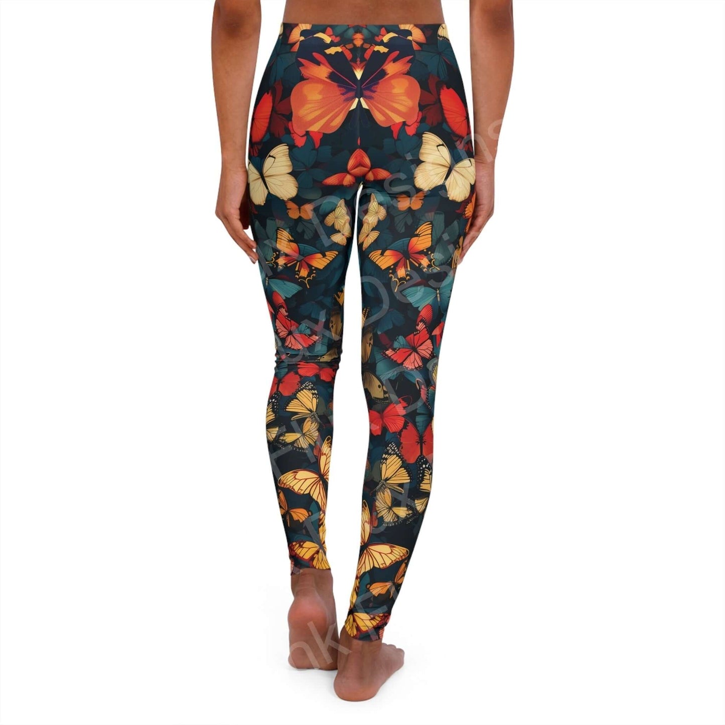 Woman wearing butterfly patterned leggings with vibrant designs, providing a back view showcasing the fit and detailed print.