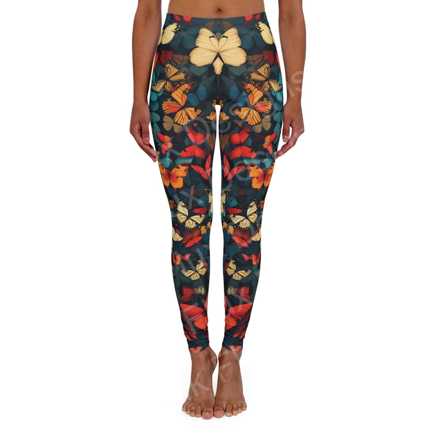 Woman wearing butterfly leggings with a colorful array of bold designs, showing front view standing pose, ideal for athleisure and workouts.