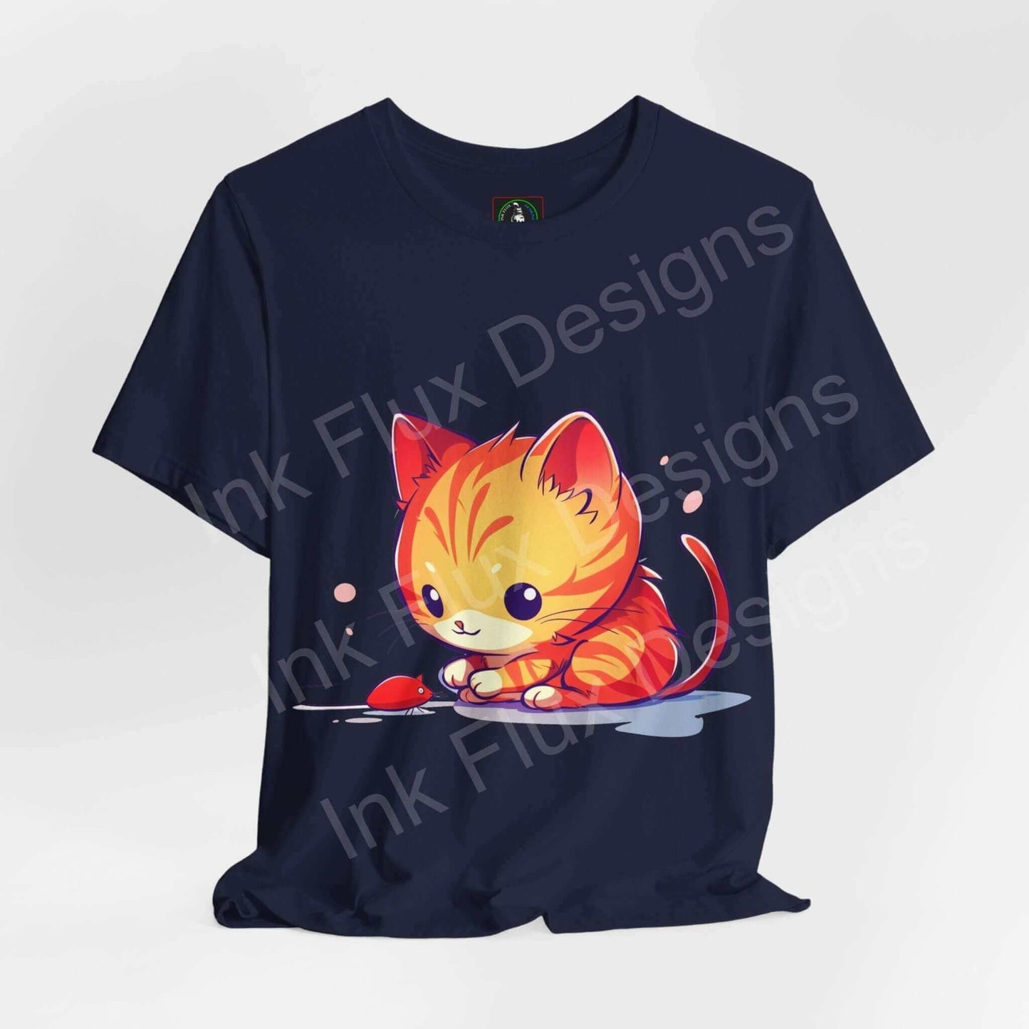 Navy blue graphic tee featuring a cute cat chasing a red mouse, ideal for cat lovers, from the "Cat and Mouse" collection by Bella+Canvas.