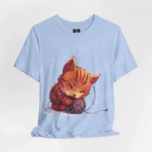 Light blue graphic tee featuring a cute cartoon cat playing with yarn, perfect for cat lovers and casual wear.