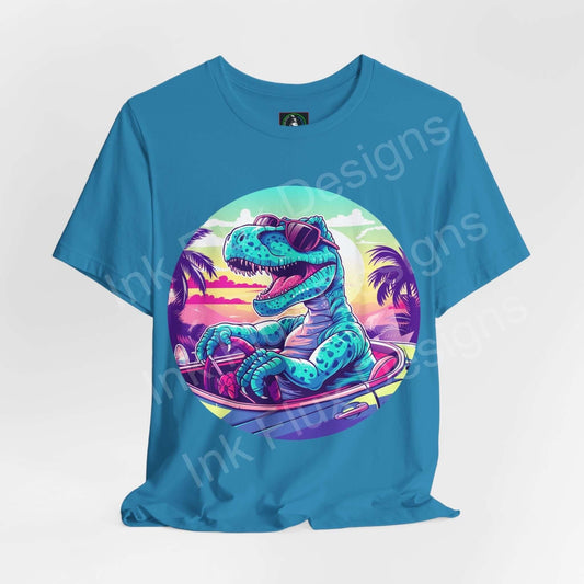 Bold graphic tee featuring a dinosaur in sunglasses cruising on a skateboard, set against a vibrant sunset background on a blue T-shirt.
