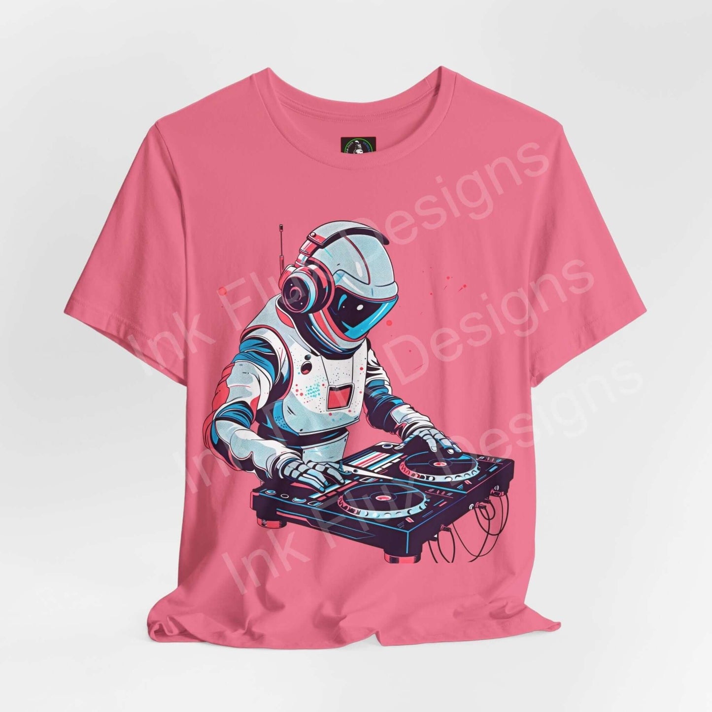 Unisex pink graphic tee featuring a DJ astronaut design, made from soft Airlume cotton by Bella+Canvas, ideal for style and comfort.