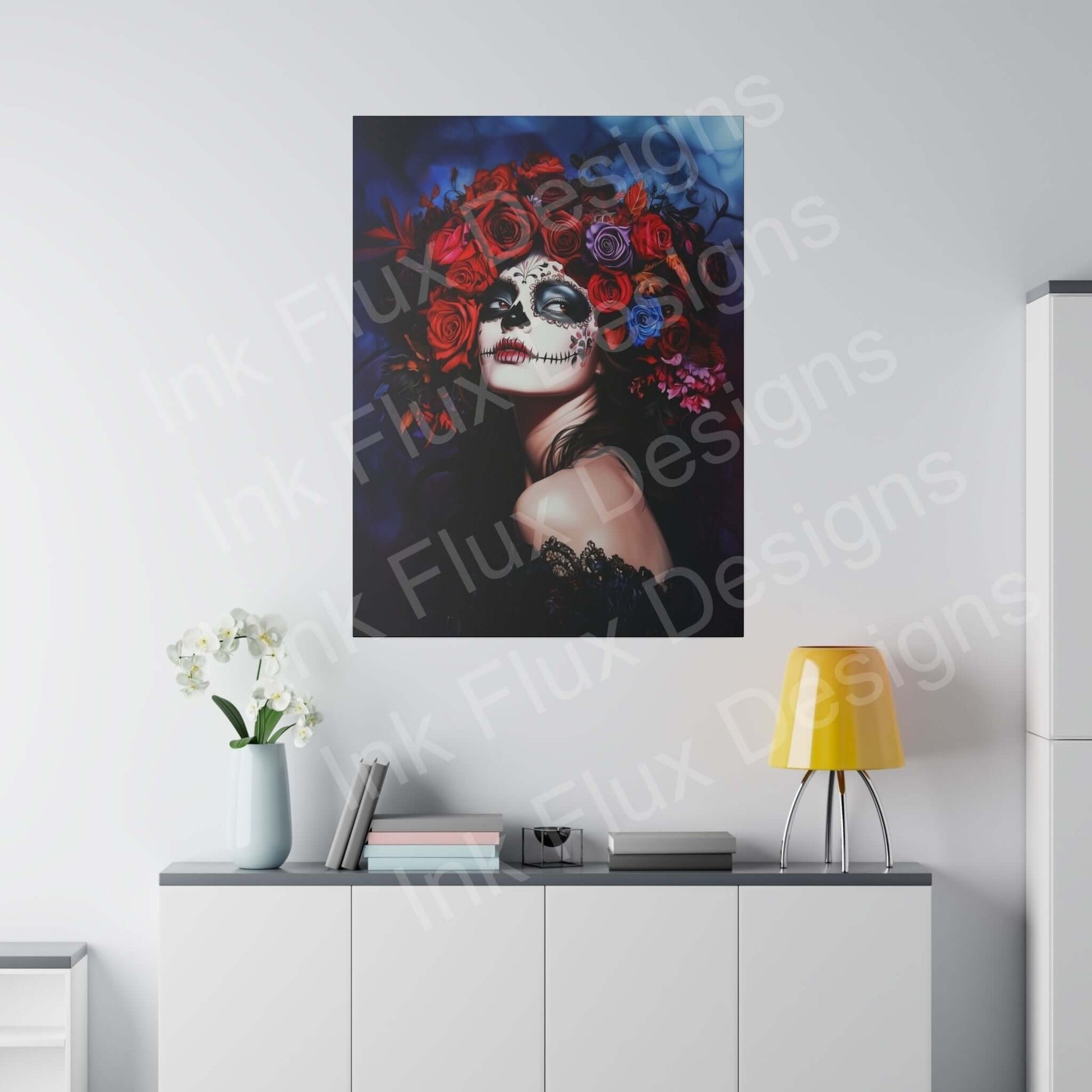 Vibrant Day of the Dead woman's portrait on eco-friendly matte canvas, boldly designed, hung above modern white cabinet in a stylish room.