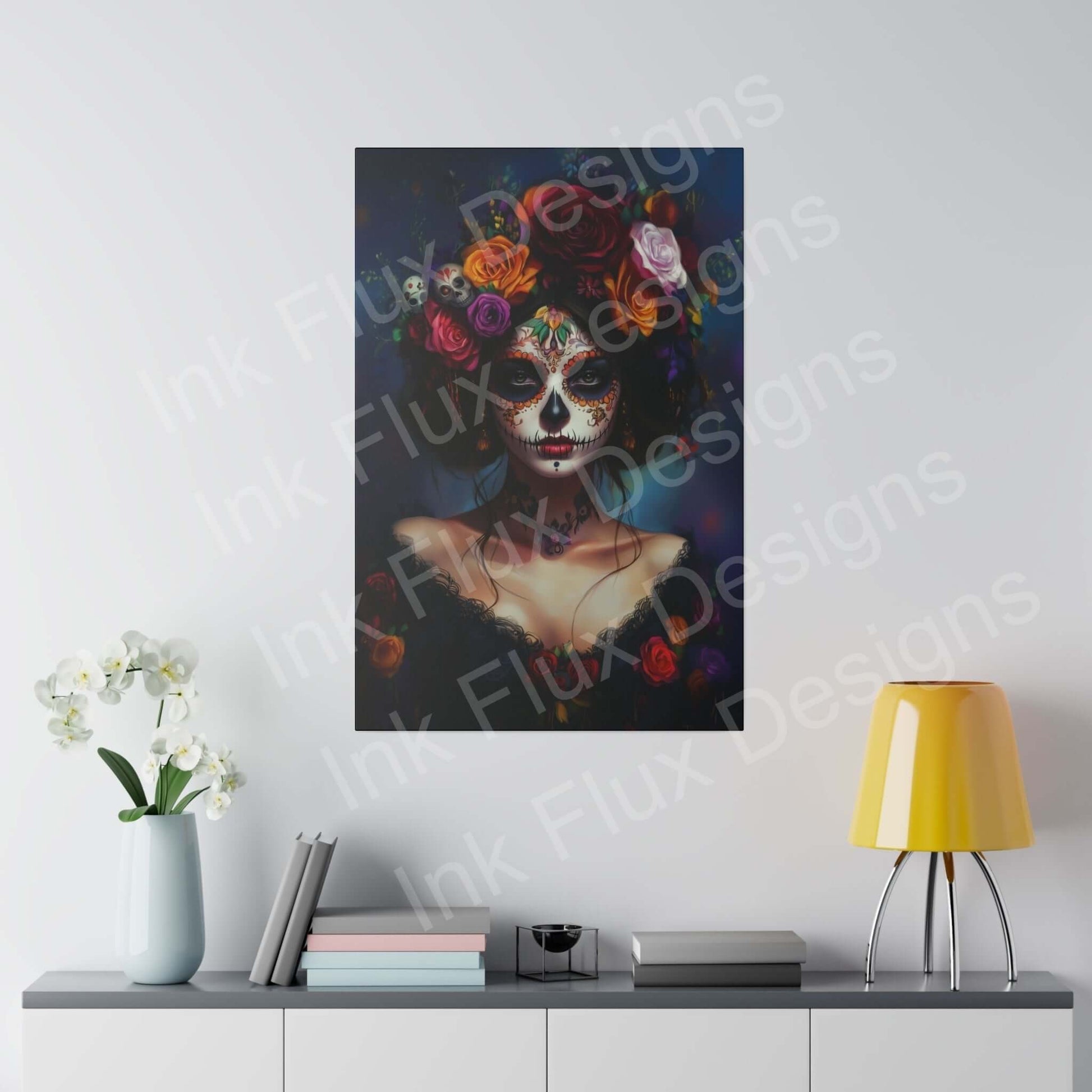 Bold designs Day of the Dead woman's portrait on eco-friendly matte canvas with vibrant colors, hung above a modern desk with a yellow lamp and white orchids.