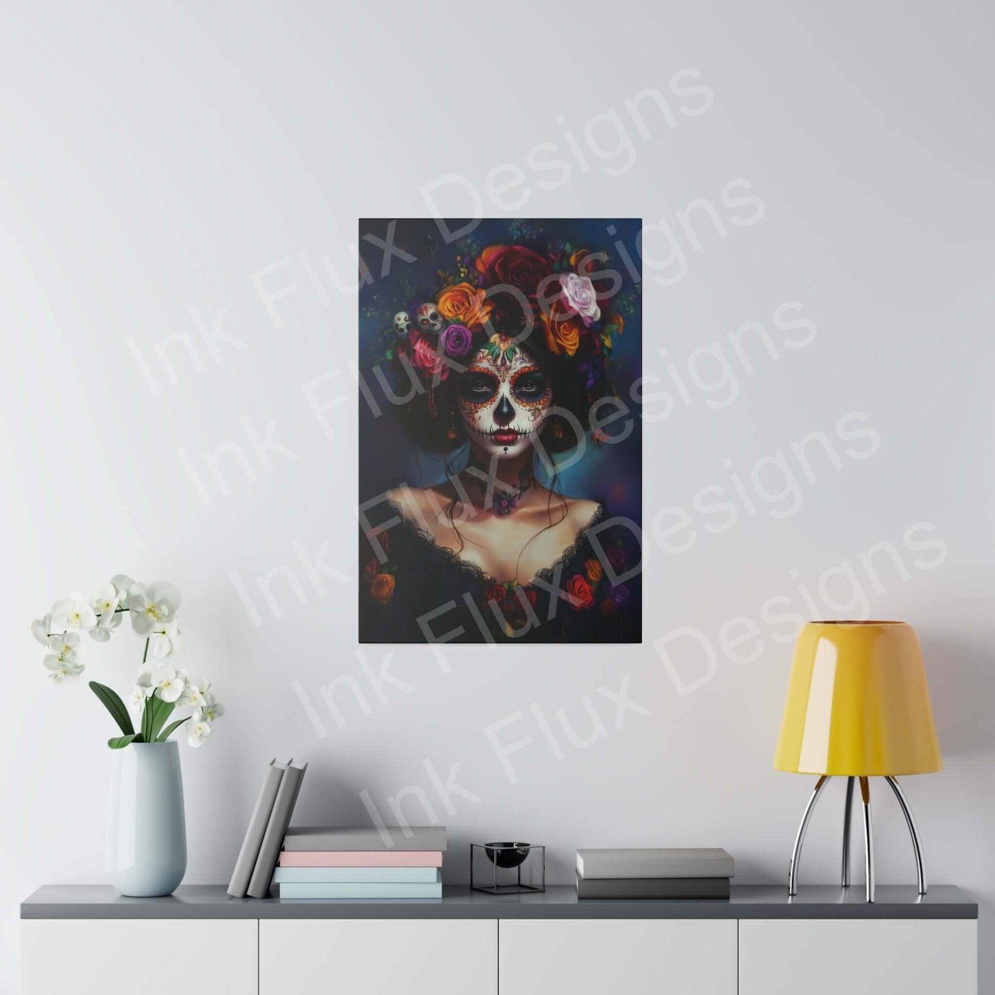 Bold designs Day of the Dead Woman's Portrait II Matte Canvas on wall above minimalist desk with lamp and flowers.