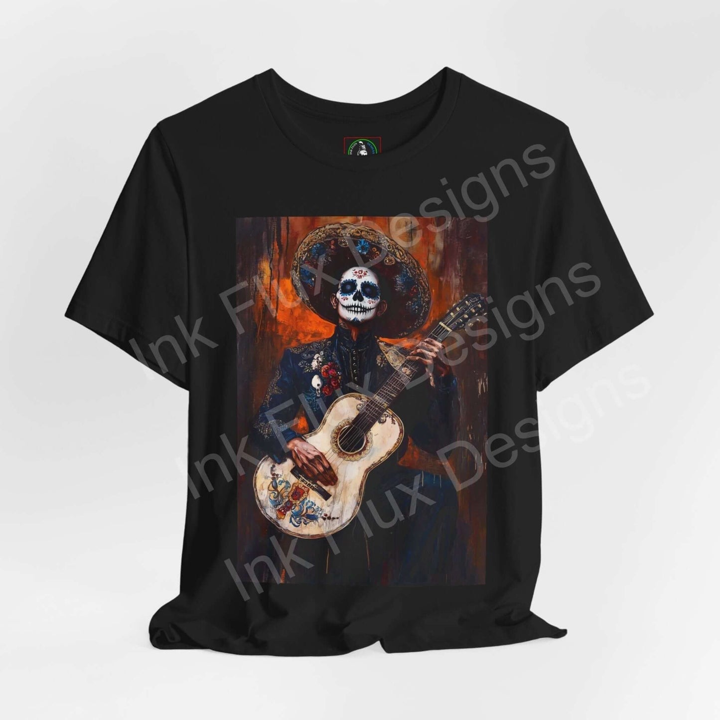 Day of the Dead themed Charro Man graphic tee featuring a skull-faced figure in traditional attire playing a guitar, perfect for DÃa de Muertos celebrations.