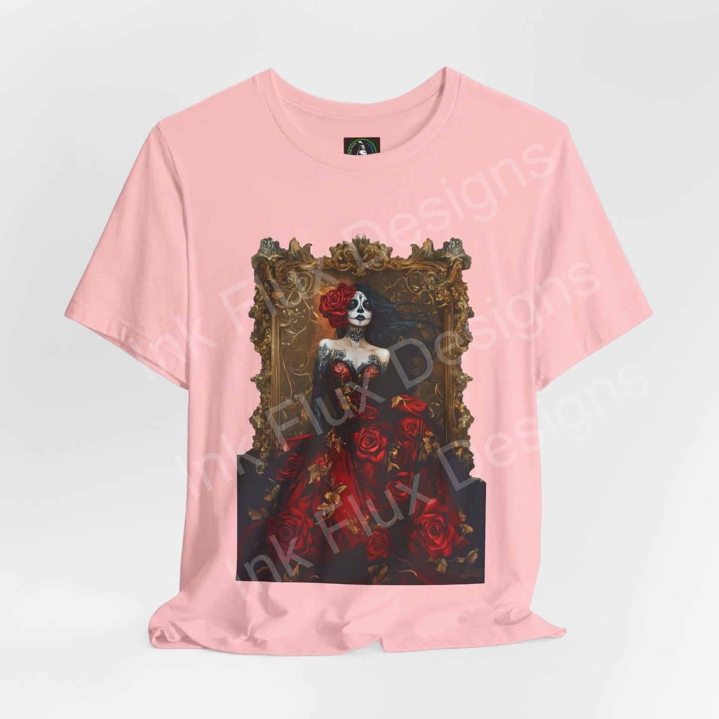 Pink 'Day of the Dead Dress of Roses II' T-shirt featuring a graphic of a skeleton in a rose-adorned dress, celebrating DÃa de Muertos.