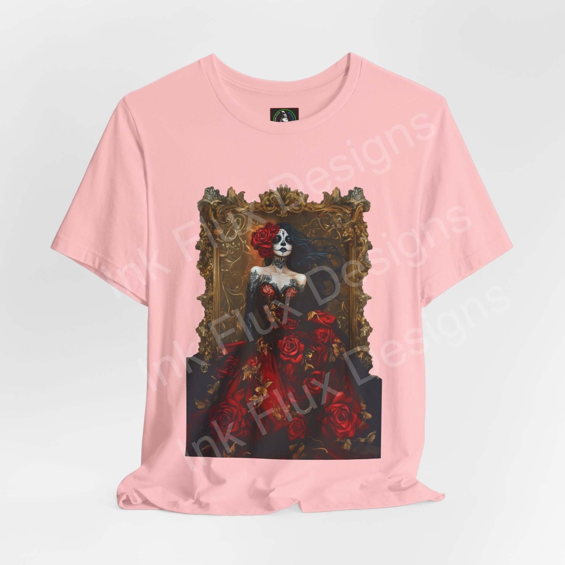 Pink 'Day of the Dead Dress of Roses II' T-shirt featuring a graphic of a skeleton in a rose-adorned dress, celebrating DÃa de Muertos.