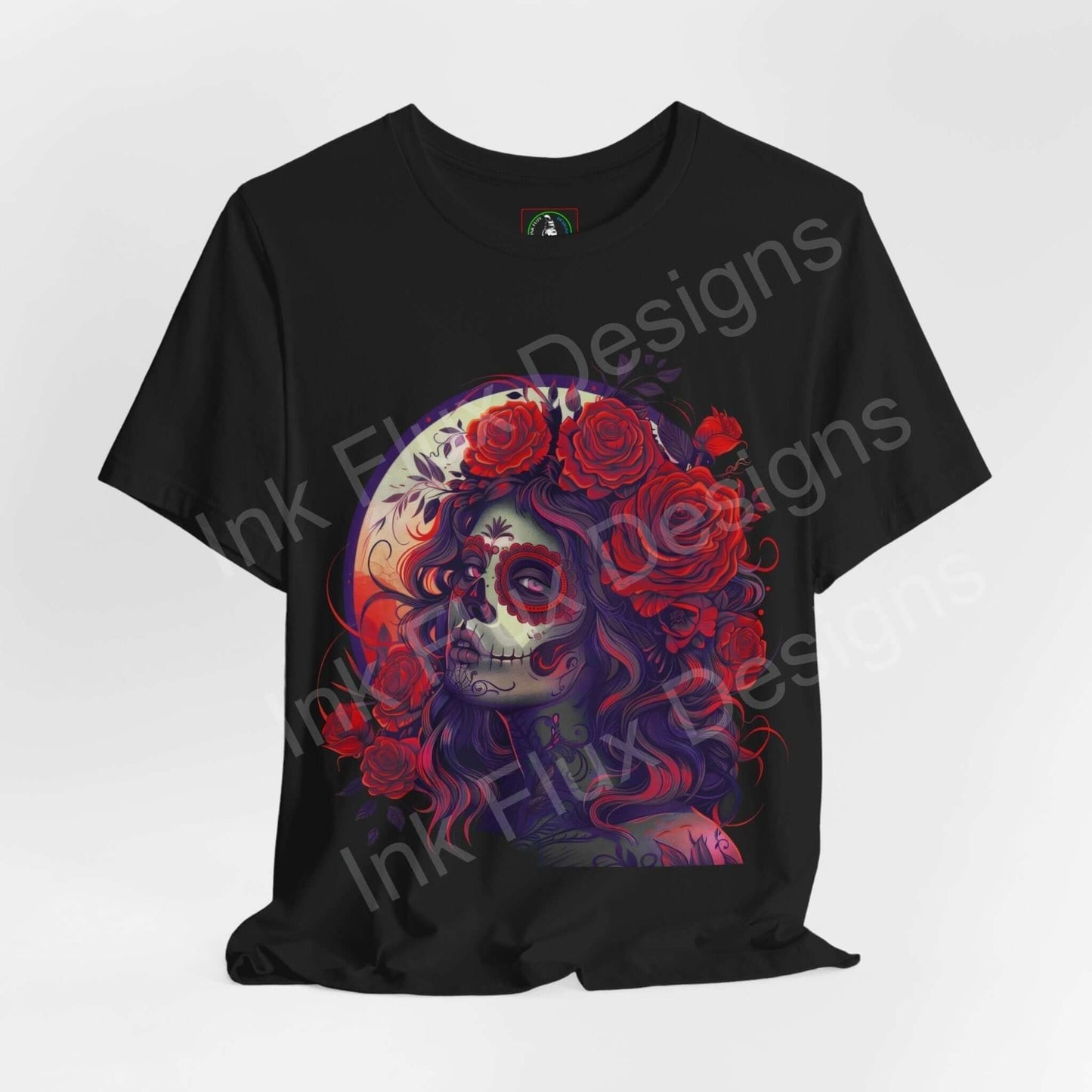 Day of the Dead themed graphic tee featuring a colorful illustration of a woman with skull makeup and floral crown on a black T-shirt.