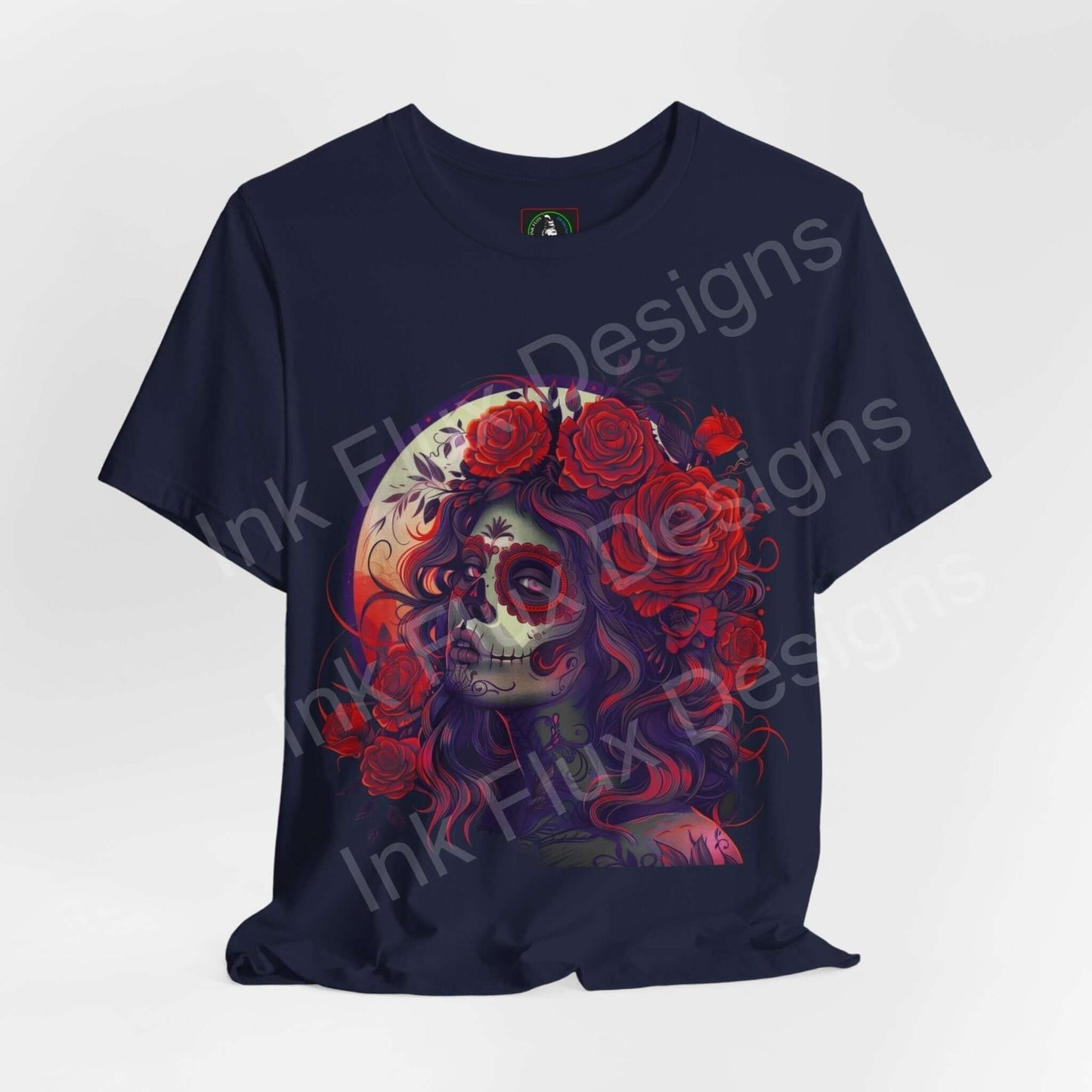 "Day of the Dead graphic tee featuring a colorful DÃa de Muertos skull with red roses design on a dark blue Bella+Canvas T-shirt"