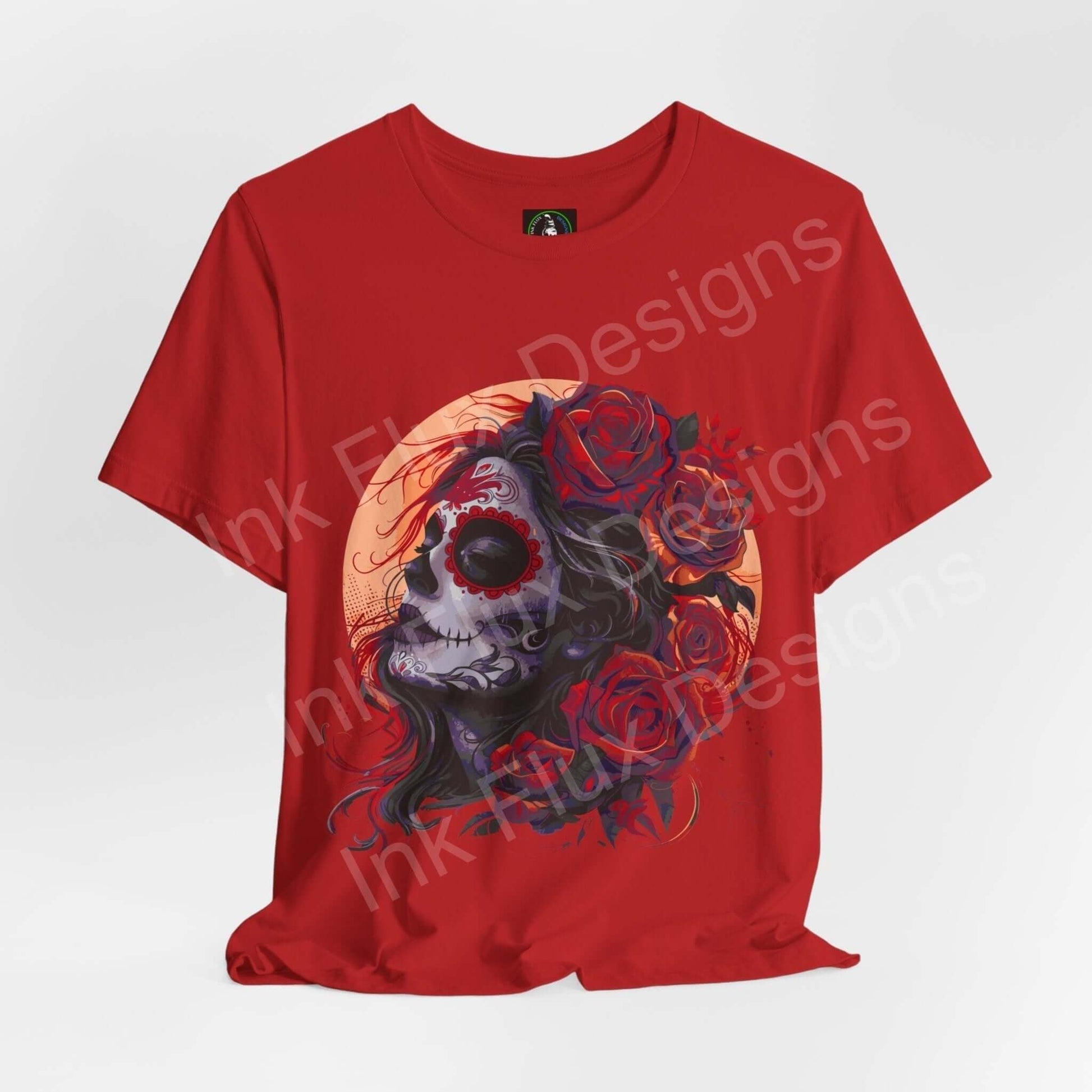 Red Day of the Dead themed graphic tee featuring a detailed skull and roses design, made from breathable Airlume cotton by Bella+Canvas.