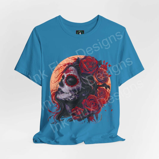 Day of the Dead graphic tee featuring a vibrant skull and roses design on a blue unisex t-shirt, perfect for DÃa de Muertos celebrations.