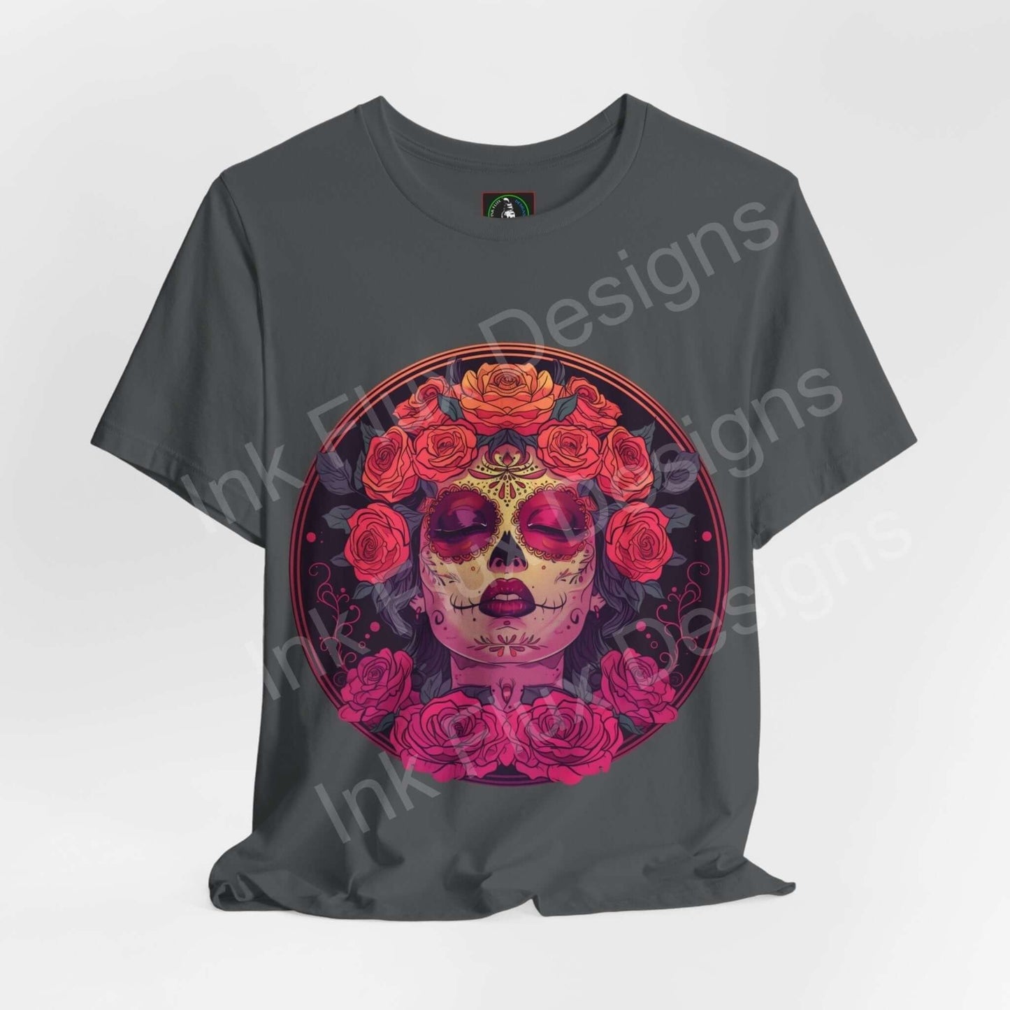 Day of the Dead-themed graphic tee featuring a vibrant DÃa de Muertos sugar skull design surrounded by roses on a dark gray shirt.