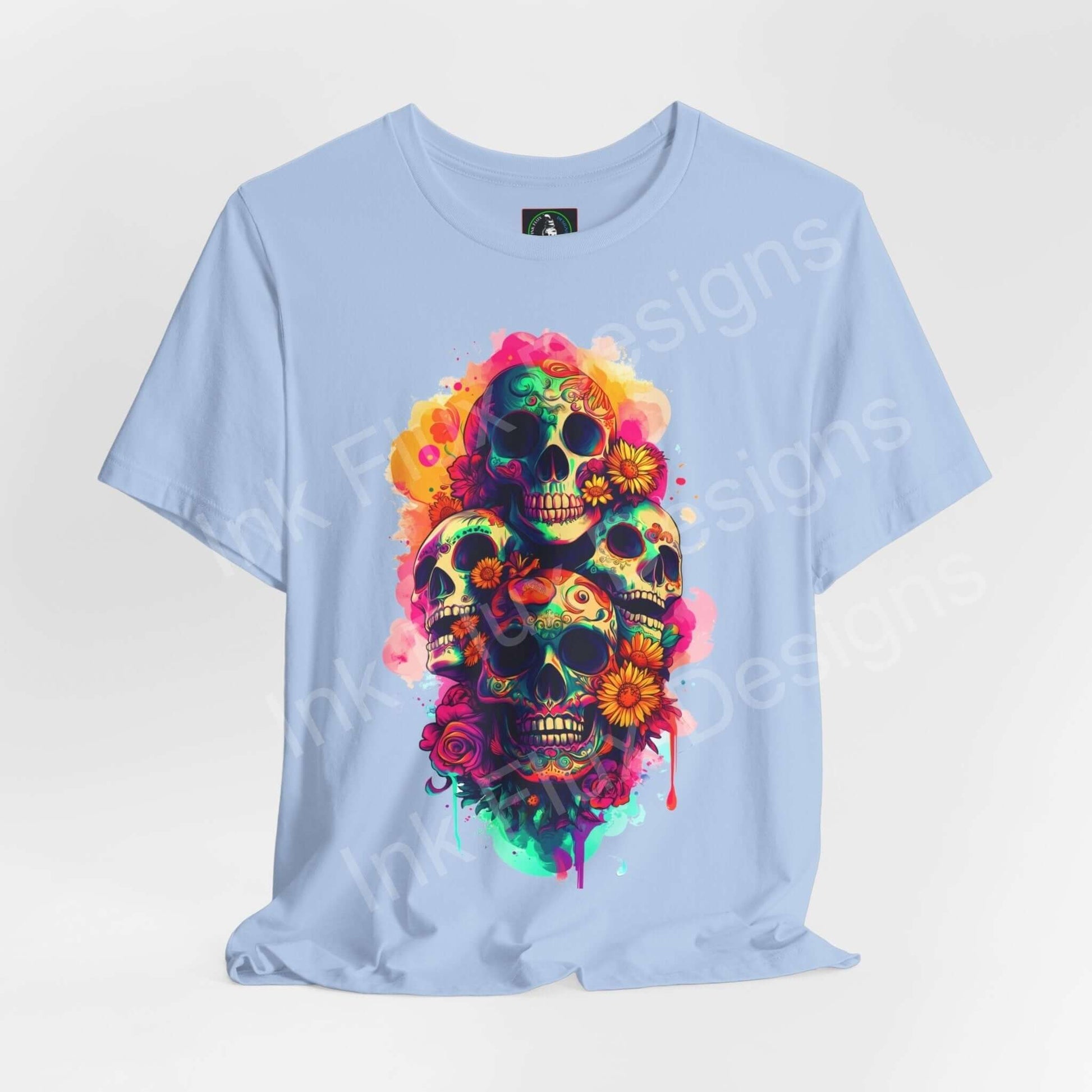 Light blue unisex T-shirt featuring vibrant Day of the Dead skull graphic design, ideal for DÃa de Muertos celebrations.