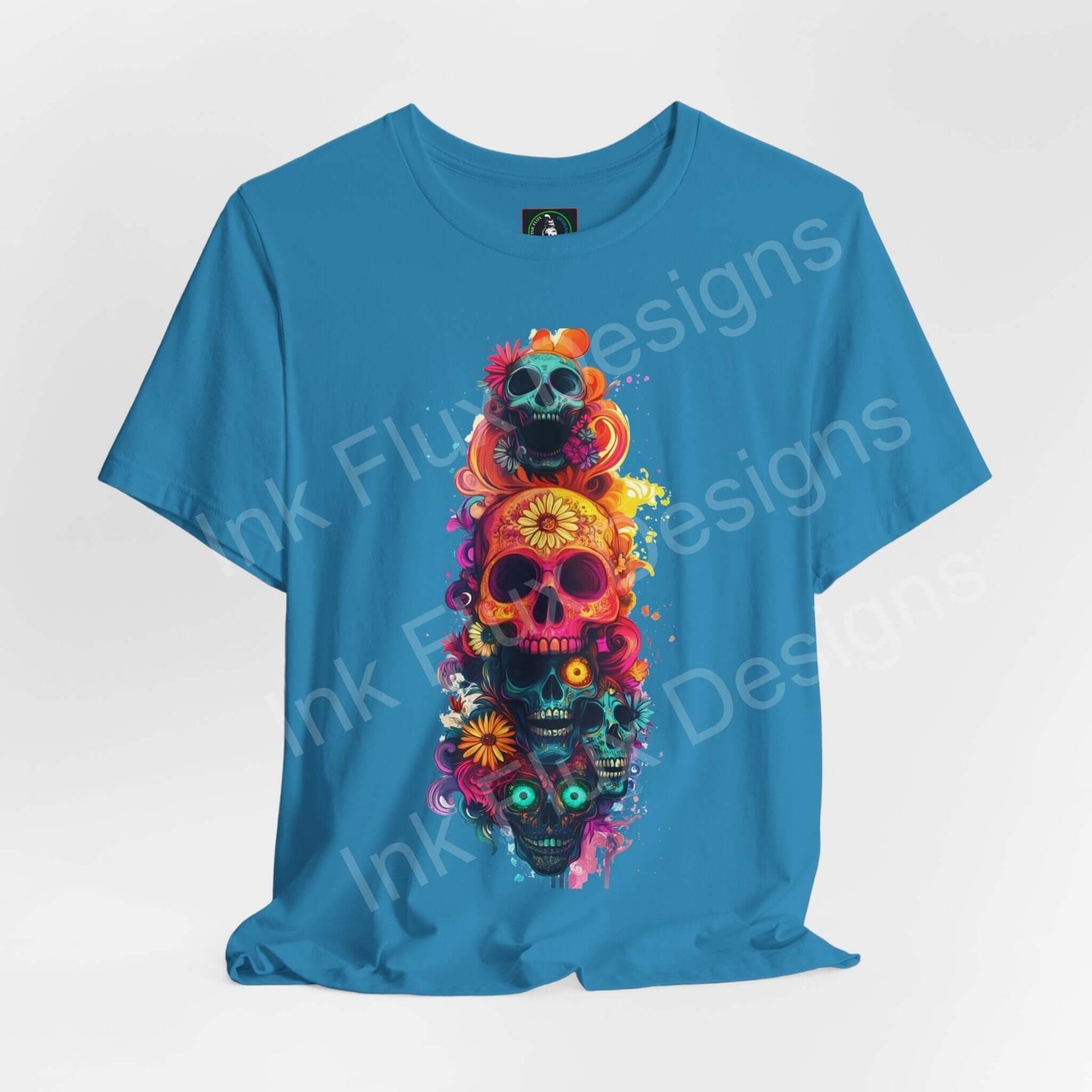 Vibrant Day of the Dead graphic tee featuring colorful skulls and floral patterns on a turquoise T-shirt, ideal for DÃa de Muertos celebrations.