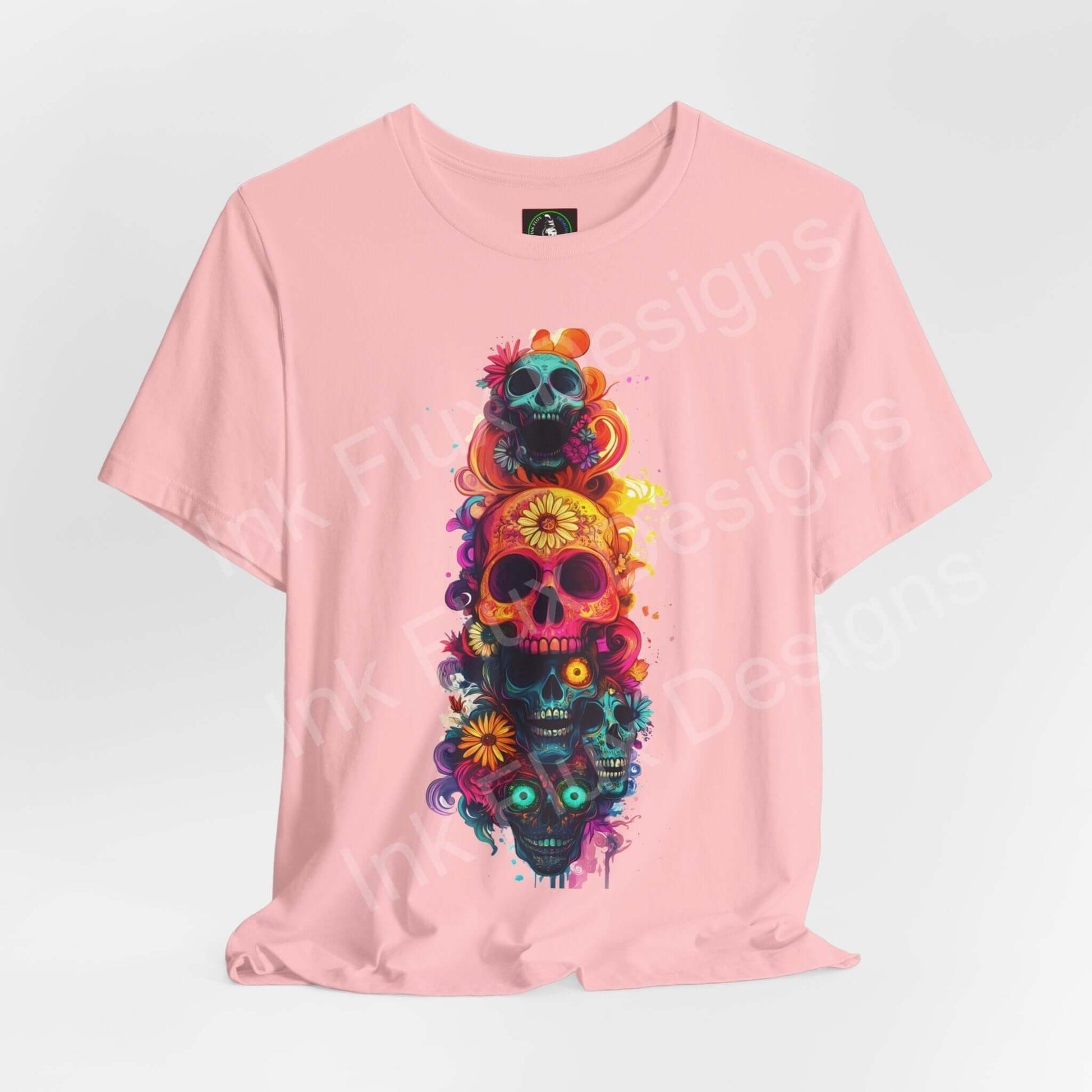 Pink Day of the Dead themed T-shirt featuring colorful skull graphics, ideal for DÃa de Muertos celebrations, made from sustainable materials.