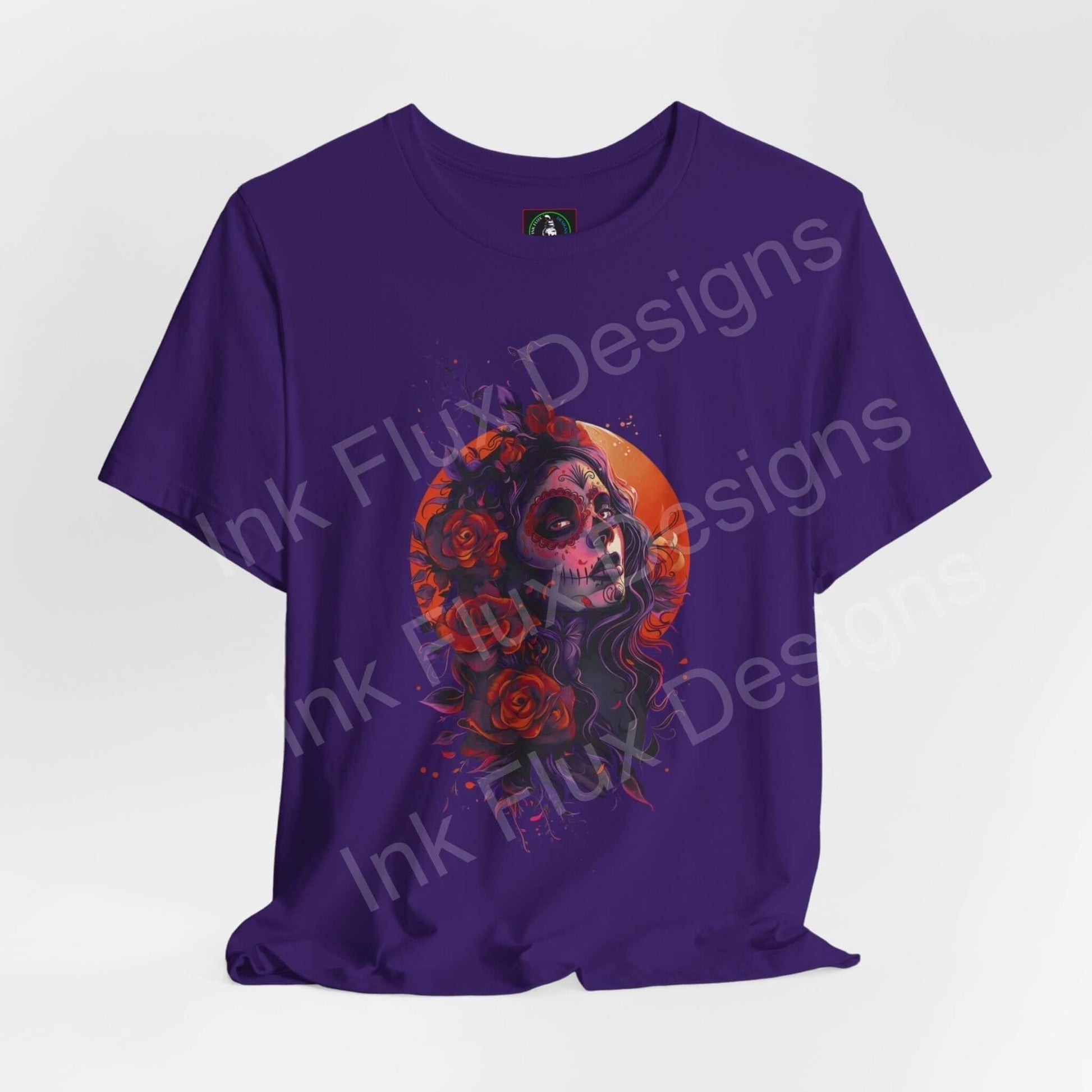 Day of the Dead themed graphic tee featuring a vibrant skull and rose design on a purple unisex T-shirt.