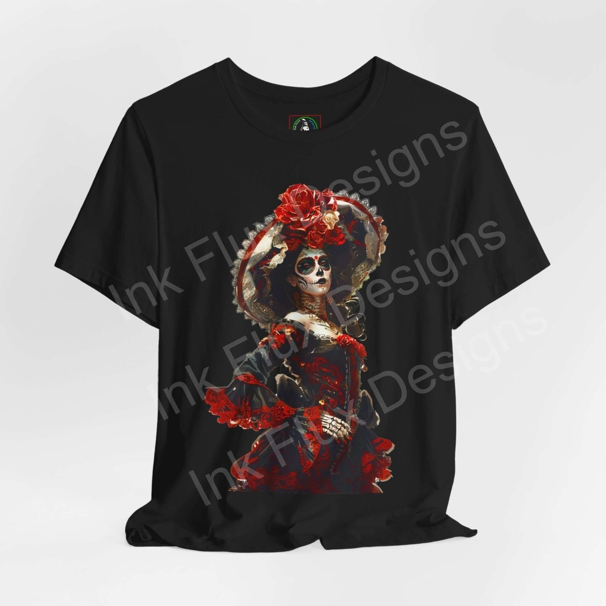 Black unisex T-shirt featuring a vibrant Day of the Dead graphic with a skull and red floral accents, ethically made by Bella+Canvas.