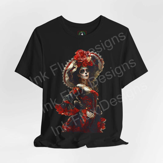 Black unisex T-shirt featuring a vibrant Day of the Dead graphic with a skull and red floral accents, ethically made by Bella+Canvas.