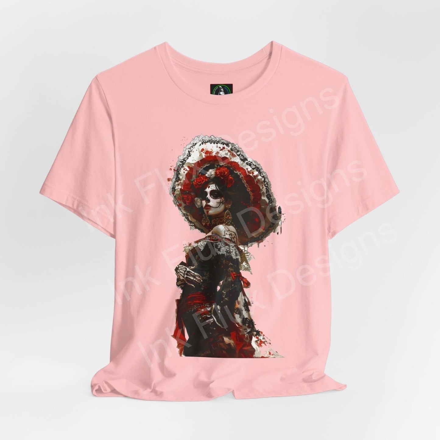 Pink Day of the Dead graphic tee featuring a detailed DÃa de Muertos design on a unisex Bella+Canvas T-shirt.