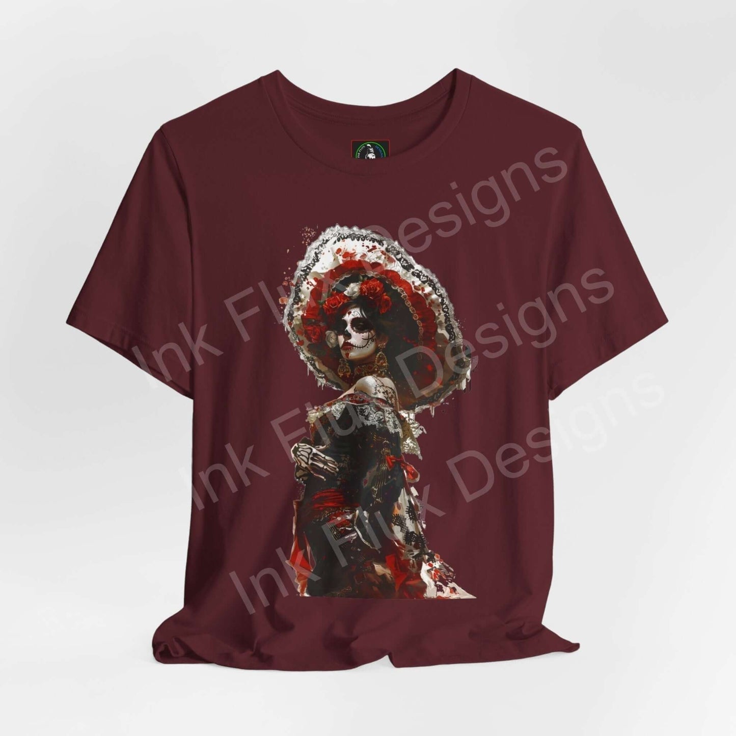 Burgundy T-shirt featuring a vibrant Day of the Dead graphic design, perfect for DÃa de Muertos celebrations.