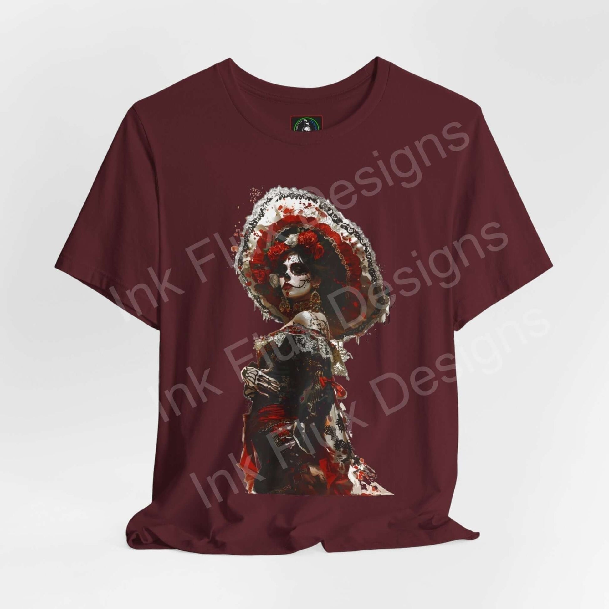 Burgundy T-shirt featuring a vibrant Day of the Dead graphic design, perfect for DÃa de Muertos celebrations.