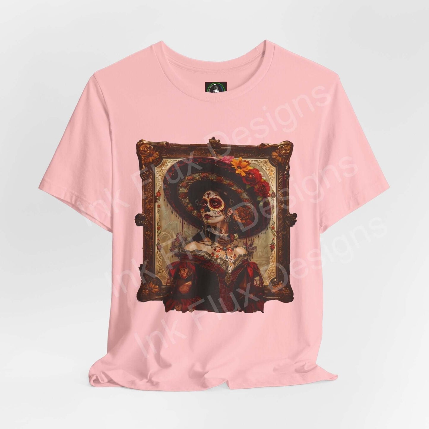 Pink Day of the Dead themed graphic tee featuring a detailed DÃa de Muertos skull design on a soft, breathable shirt.
