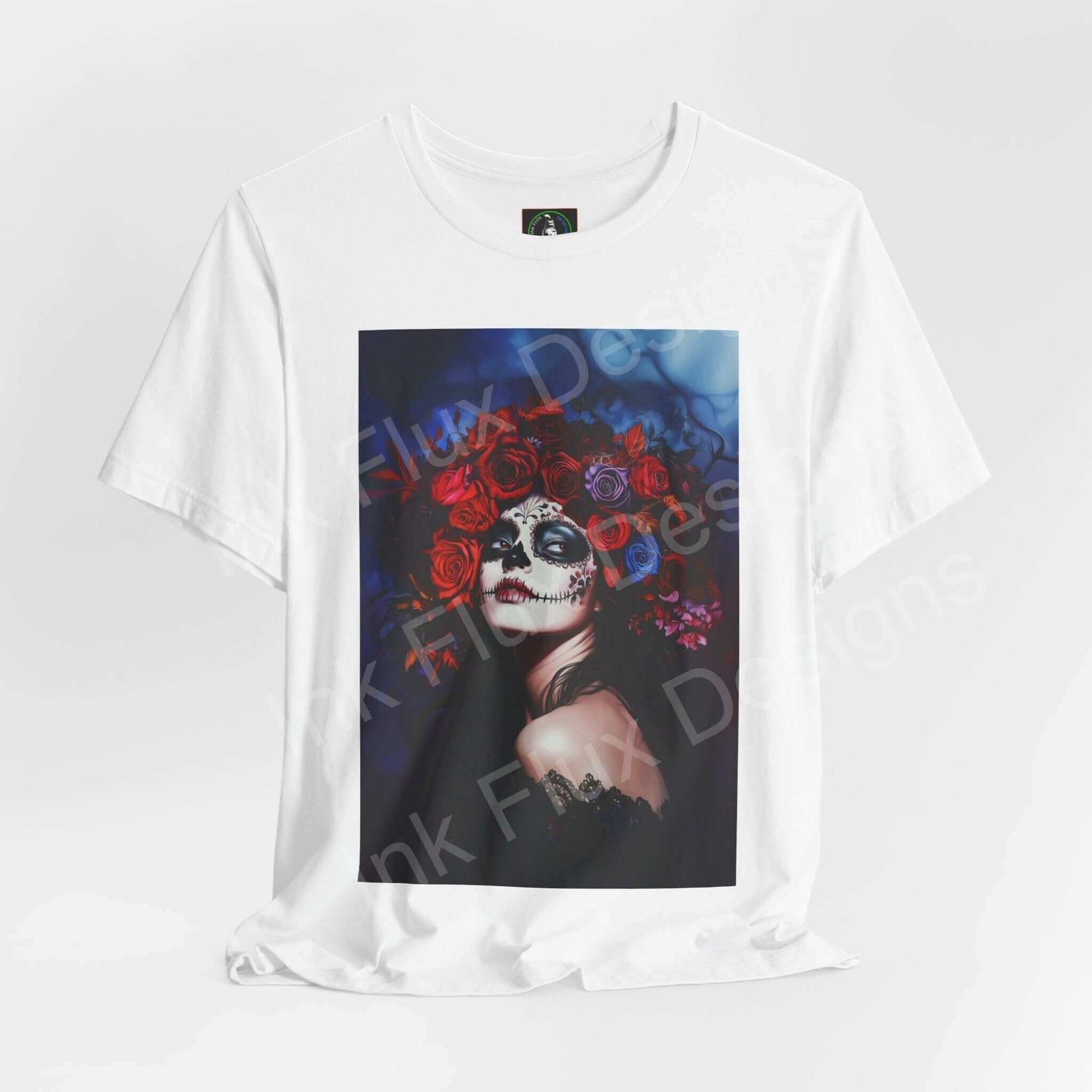 Day of the Dead themed T-shirt featuring a graphic of a woman with a skull face and red floral crown, ideal for DÃa de Muertos celebrations.