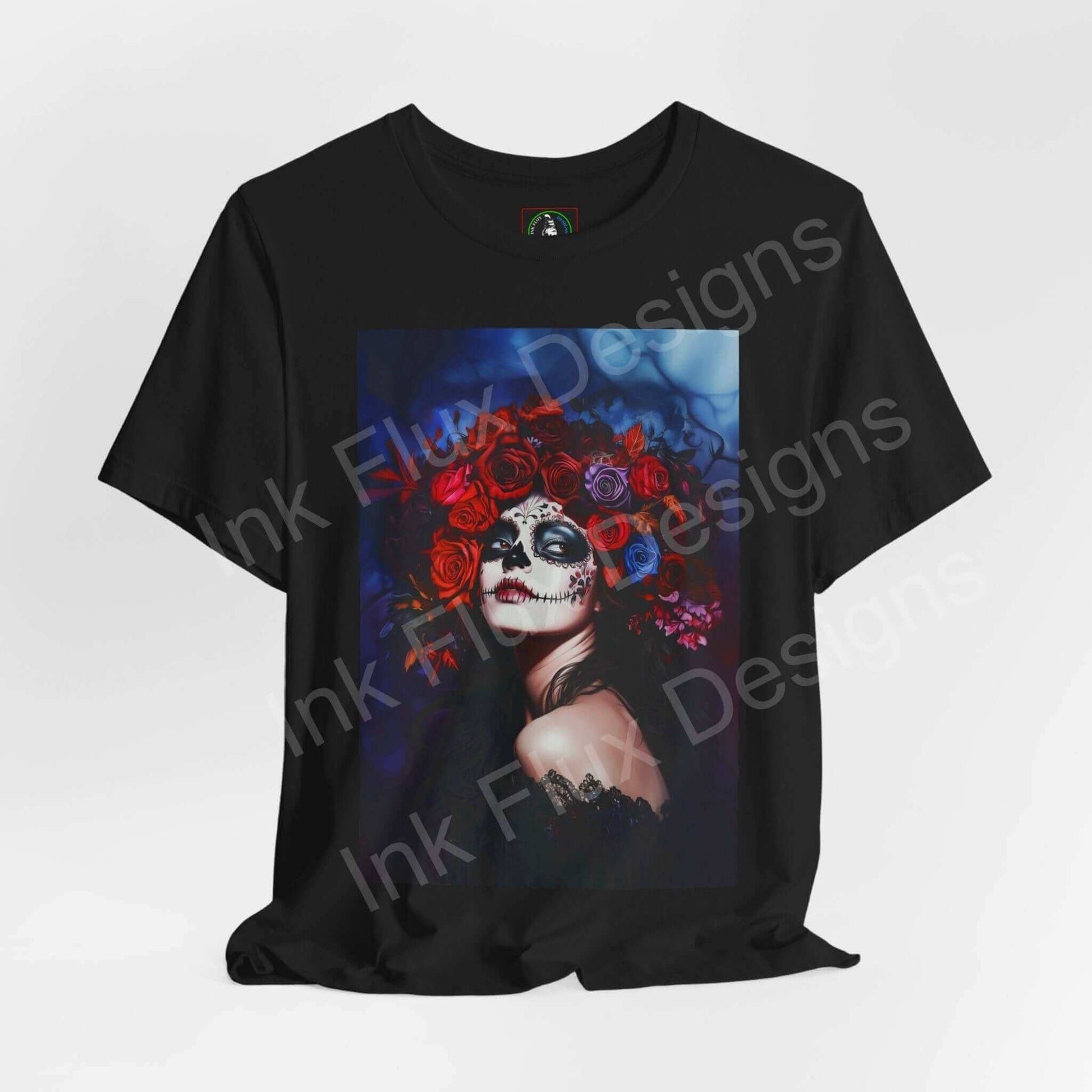 Day of the Dead themed graphic tee featuring a woman's portrait with floral and skull makeup, available in unisex sizes by Ink Flux Designs.