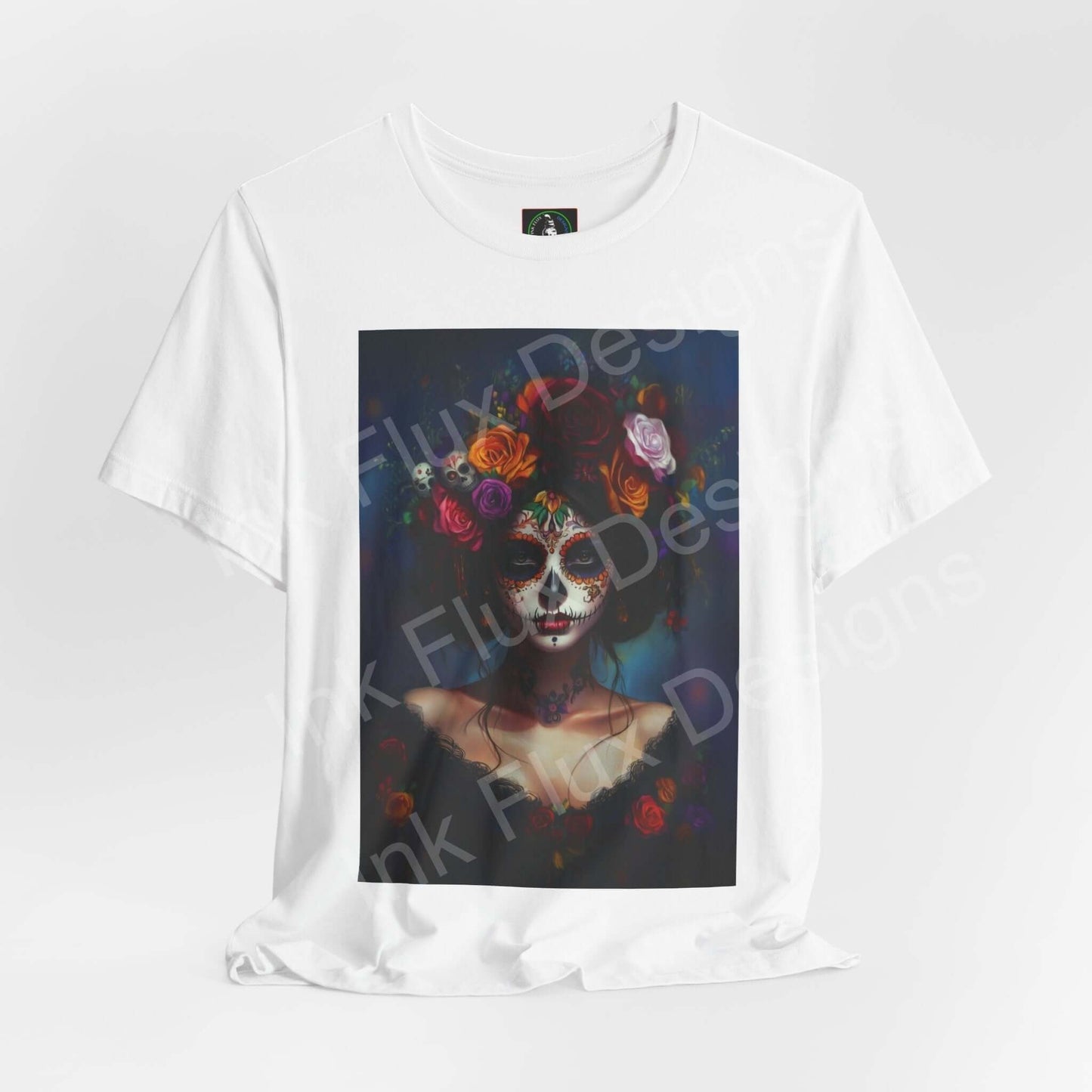 Day of the Dead themed graphic tee featuring a woman's portrait with DÃa de Muertos makeup, adorned with colorful floral designs, available in unisex sizes.