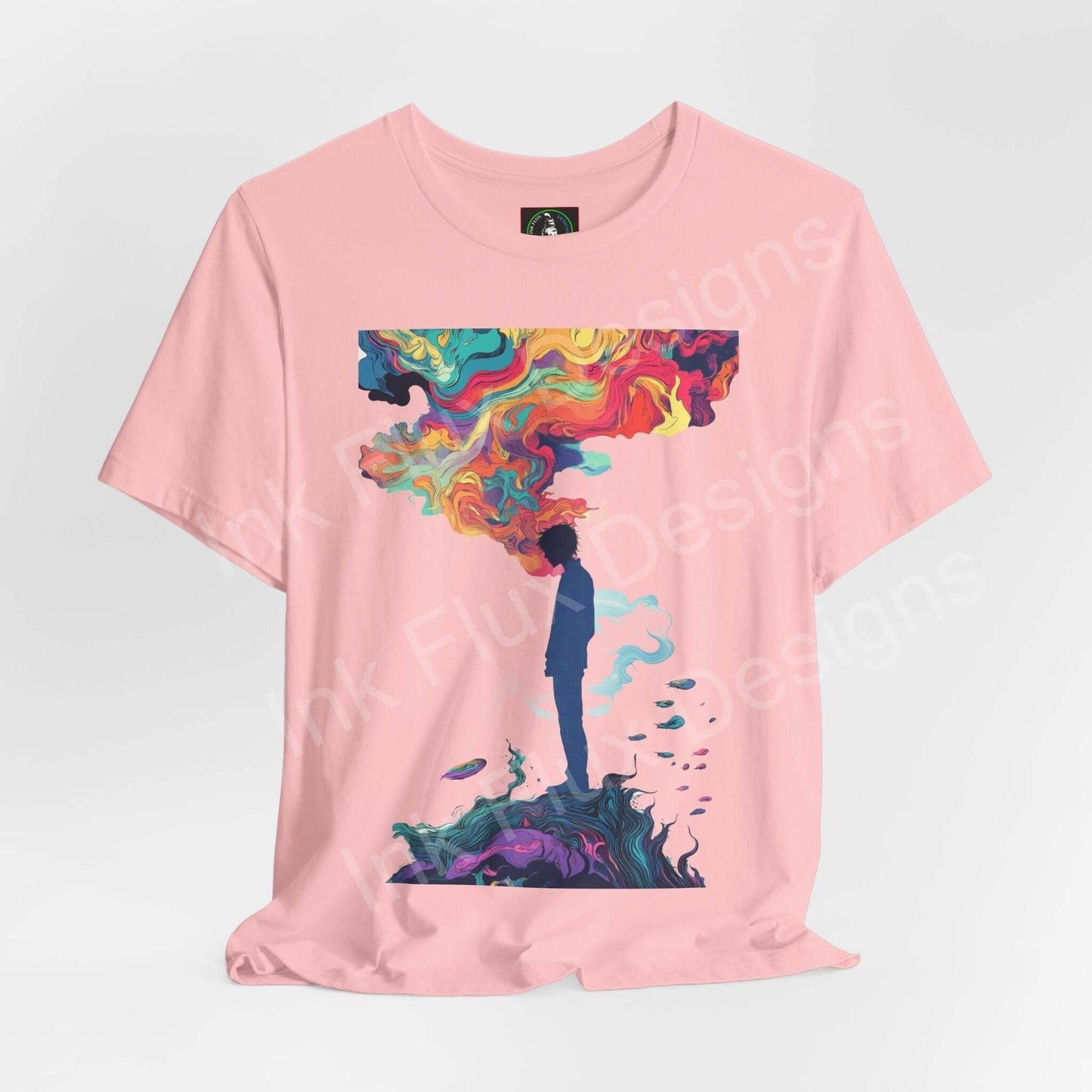 Unisex pink Dreamscape II T-shirt with bold psychedelic graphic of a person standing under a vibrant, trippy cloud on Bella+Canvas tee.