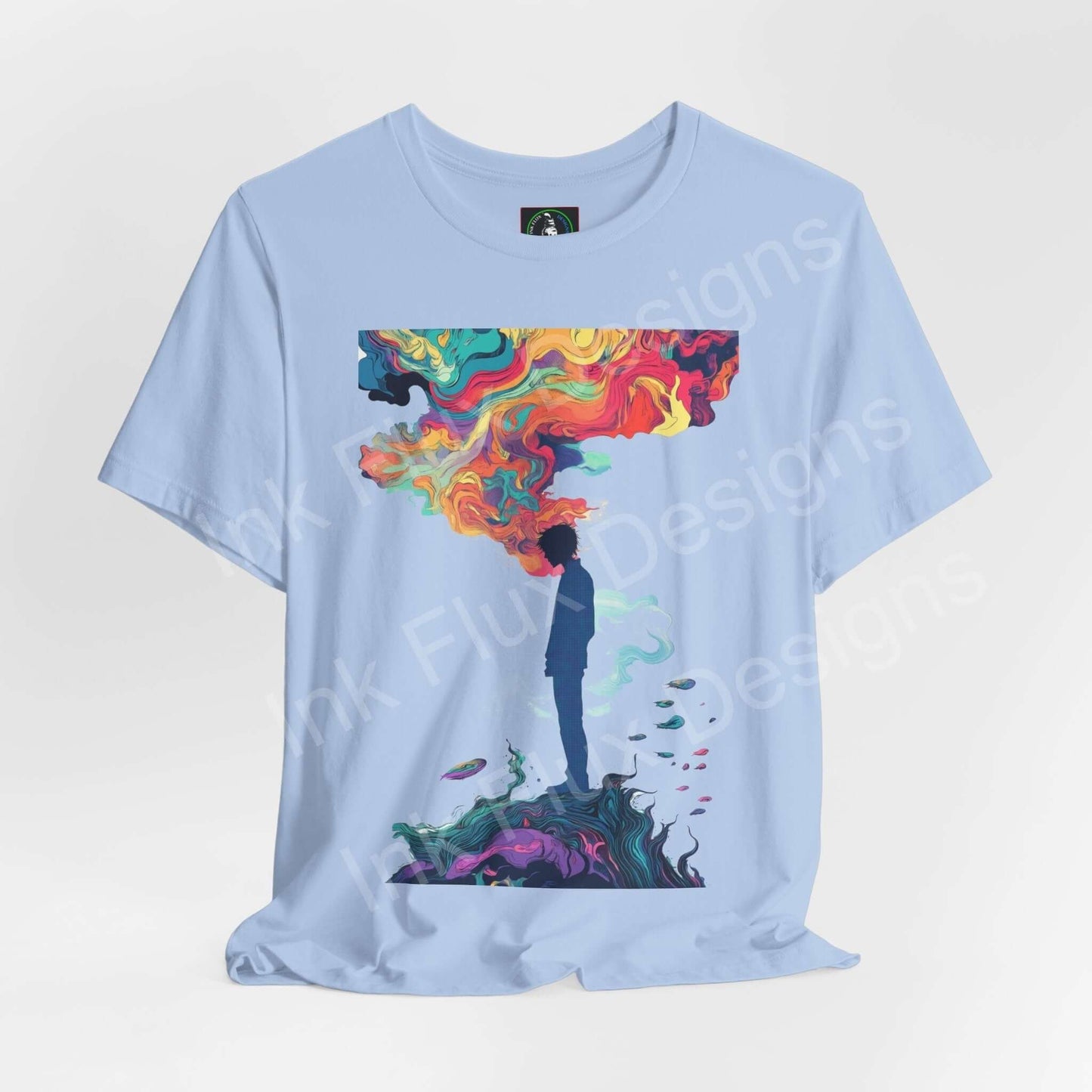 Unisex light blue Dreamscape II T-shirt featuring bold psychedelic graphics with a person under a colorful cloud, designed for style and comfort.