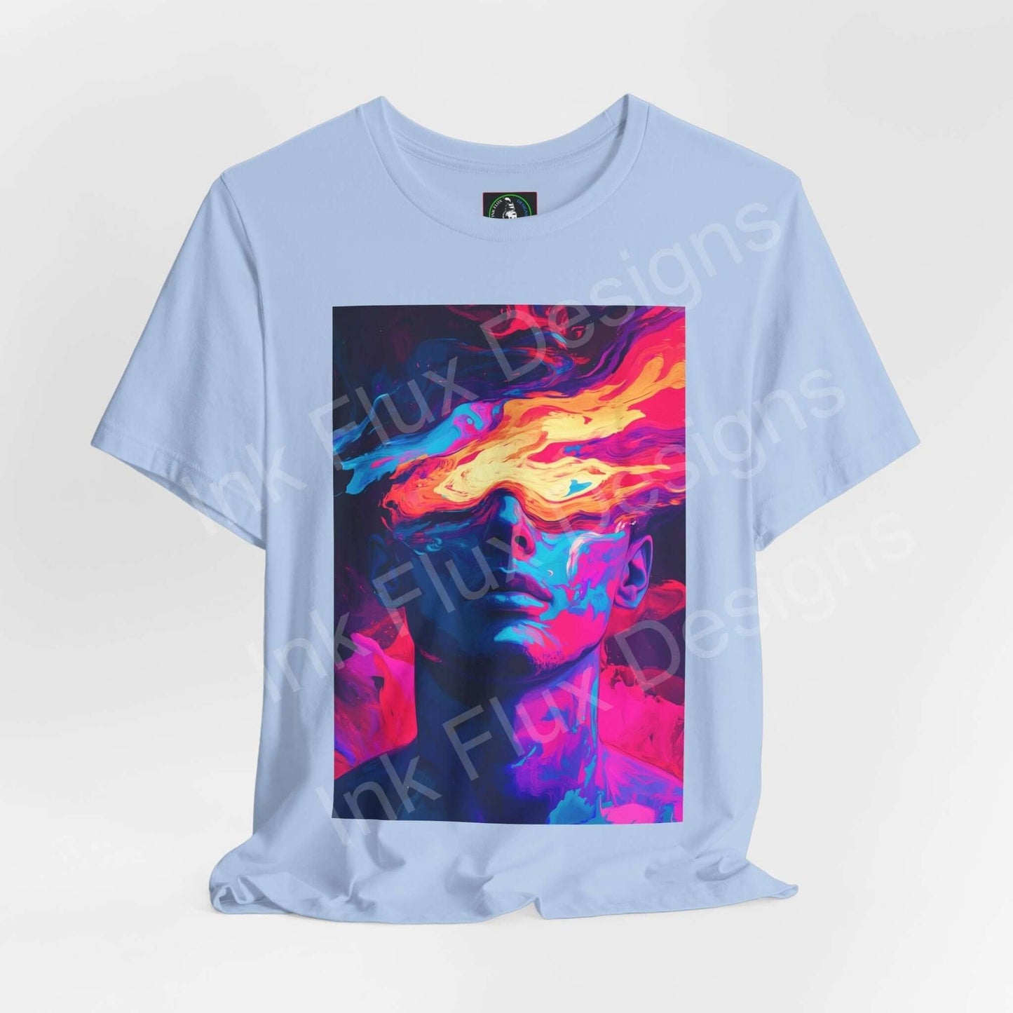 Unisex light blue T-shirt featuring a bold, psychedelic graphic of a colorful face, from the Dreamscape IV collection by Bella+Canvas.