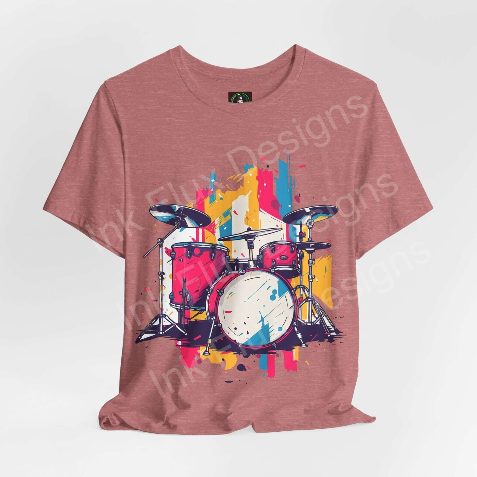 Bold graphic tee featuring a colorful drum set design on a pink unisex jersey T-shirt from Bella+Canvas, showcasing style and comfort.