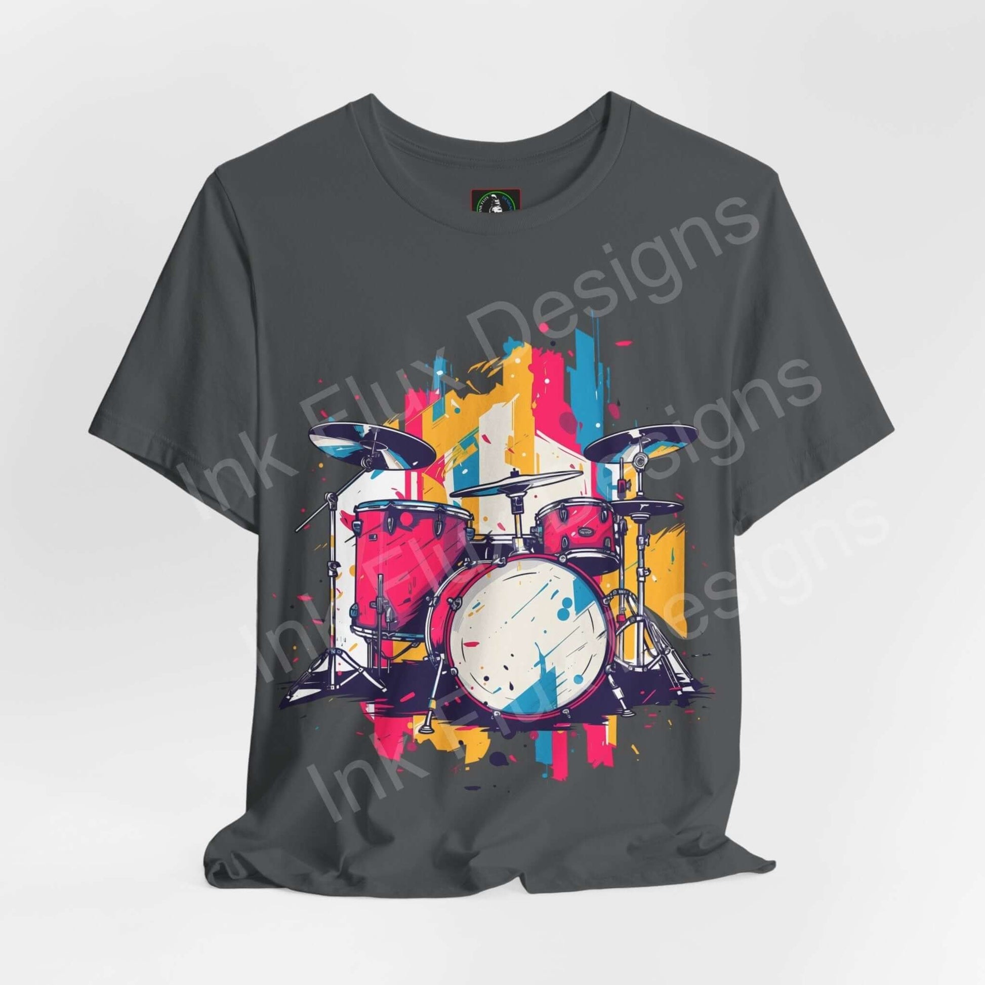 Gray unisex jersey T-shirt featuring a colorful, bold graphic of a drum set, designed for style and comfort, by Bella+Canvas.