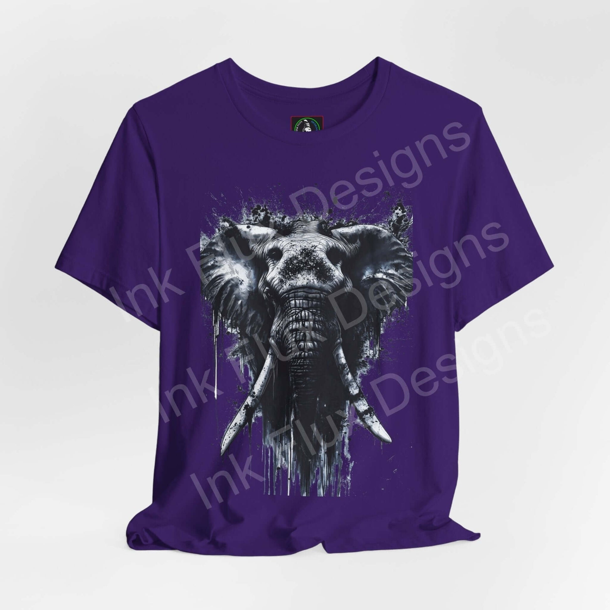 Purple unisex T-shirt featuring a white elephant spirit animal graphic, designed for style and comfort by Bella+Canvas.