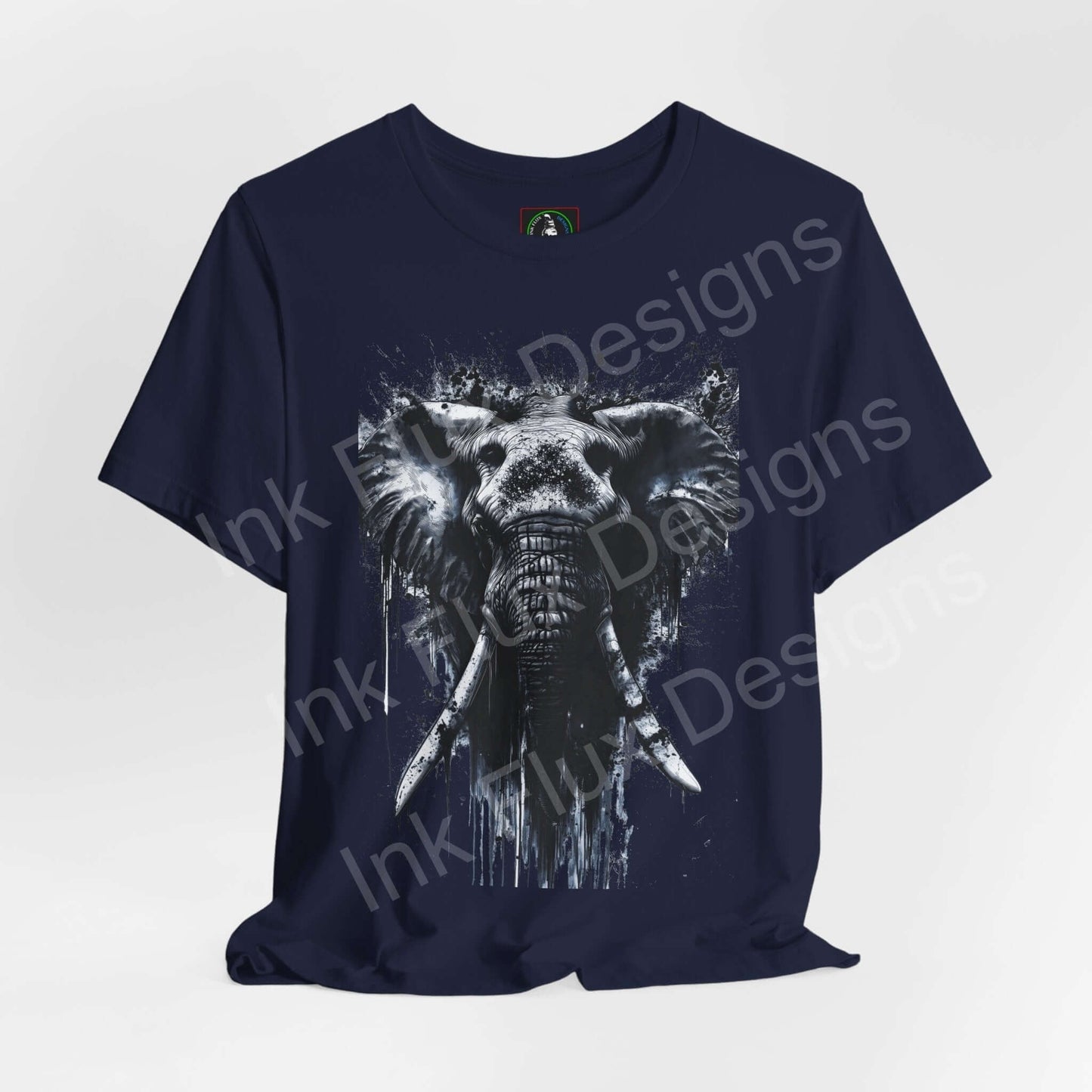 Navy blue unisex T-shirt featuring a graphic of an elephant in white, titled 'Elephant Spirit II' from Bella+Canvas, emphasizing spirit animals and sustainability.