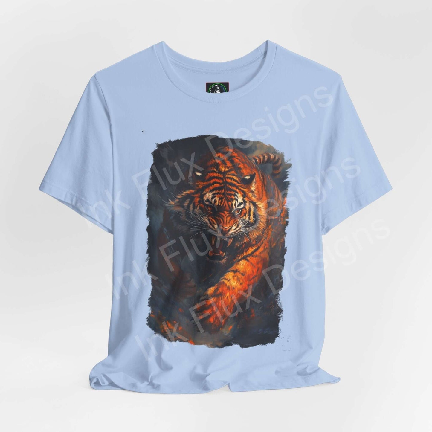 Light blue unisex T-shirt featuring a vibrant graphic of an enraged Siberian tiger, ideal for lovers of spirit animals and graphic tees.