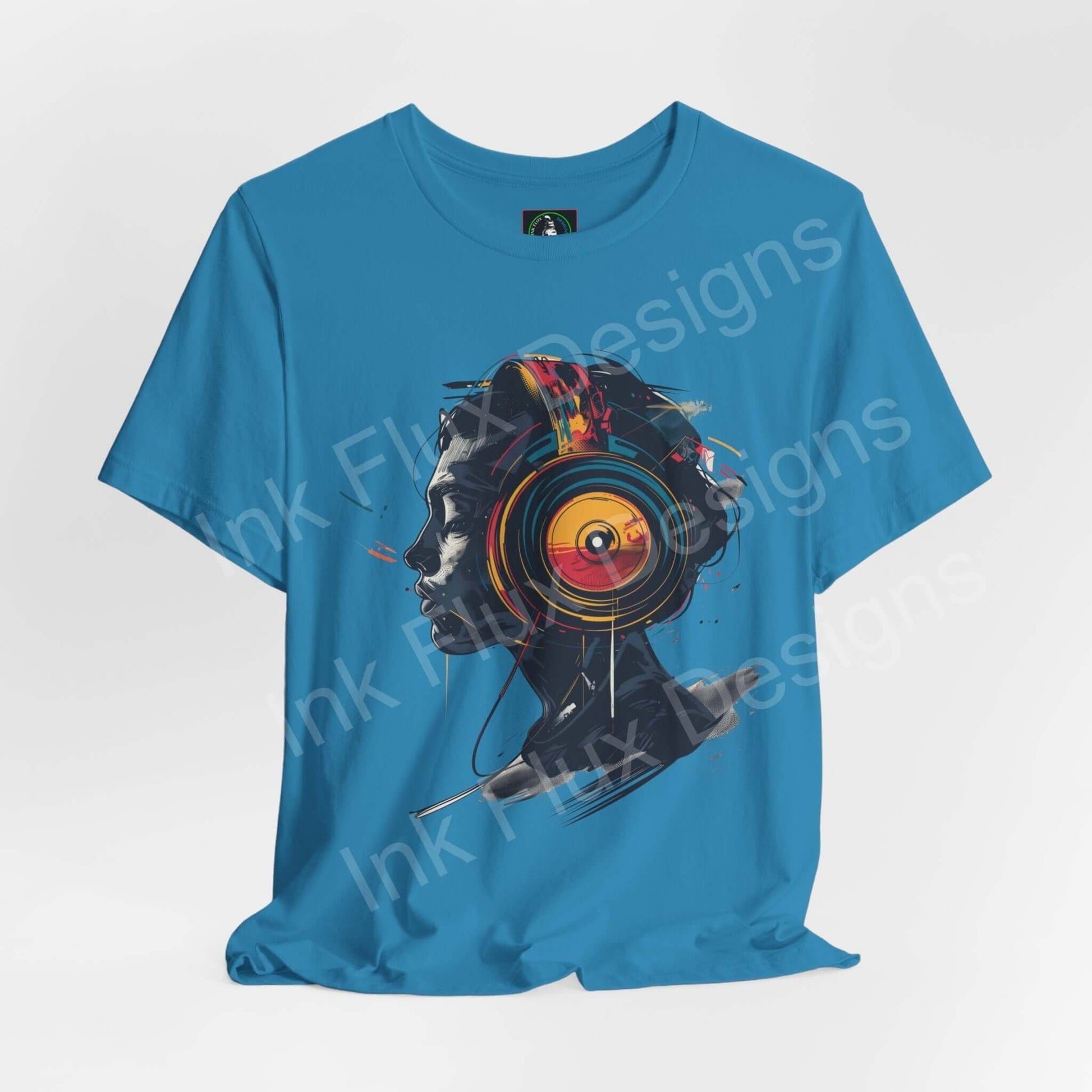 Blue unisex T-shirt featuring bold graphic design of a colorful abstract portrait, ideal for fashion-forward graphic tees.