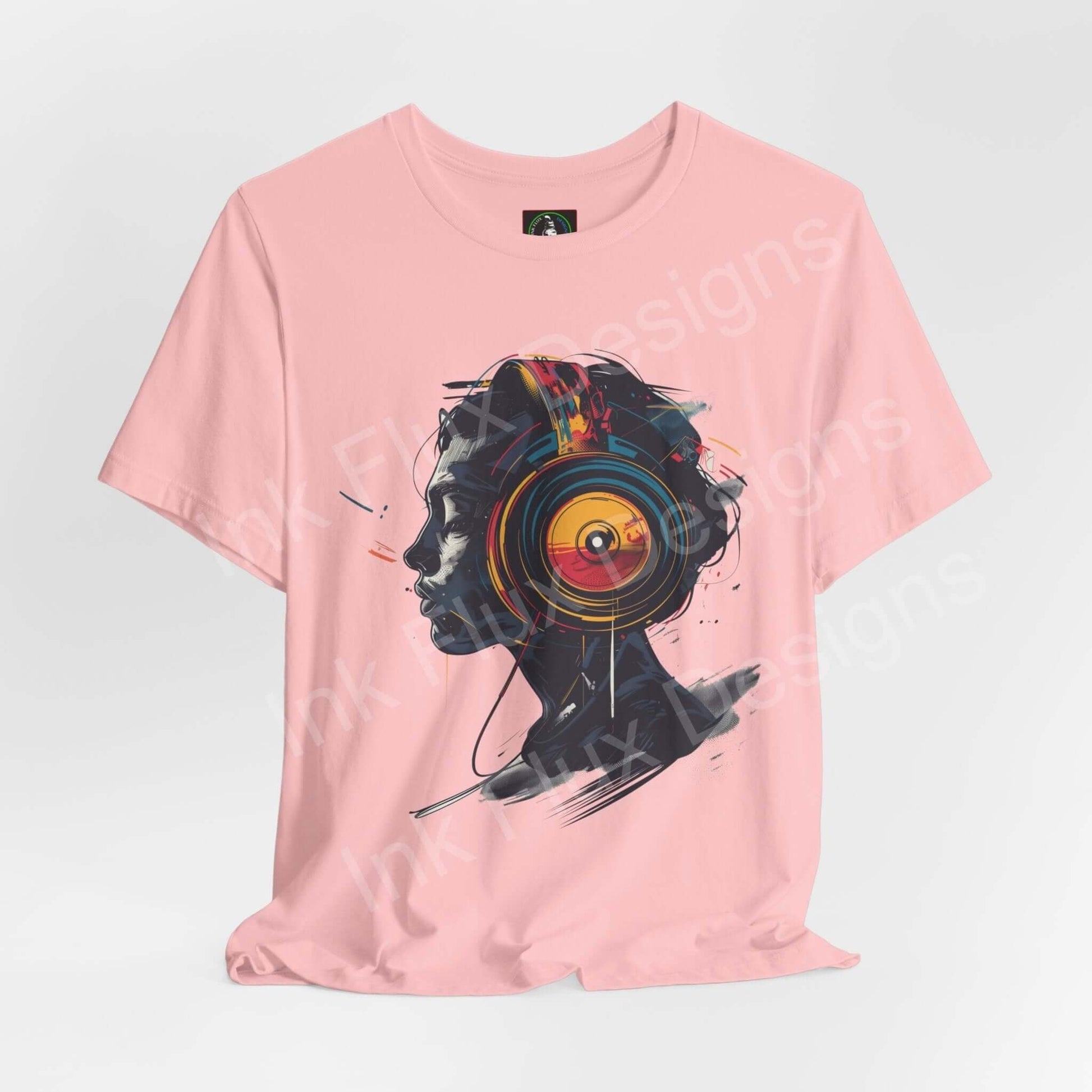 Pink unisex jersey T-shirt with bold graphic design featuring a stylized speaker on Bella+Canvas shirt, perfect for style and comfort.