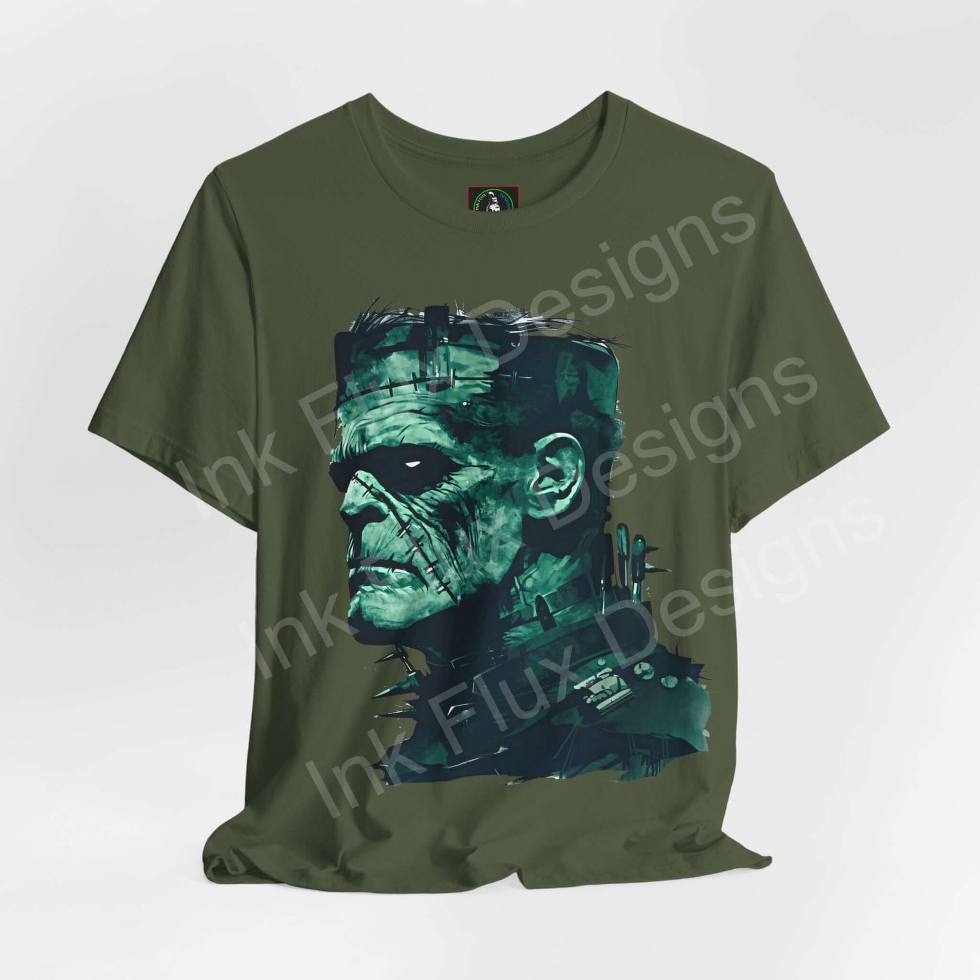 Olive green unisex Frankenstein graphic tee by Bella+Canvas, featuring a bold art of Frankenstein's face, ideal for Halloween.