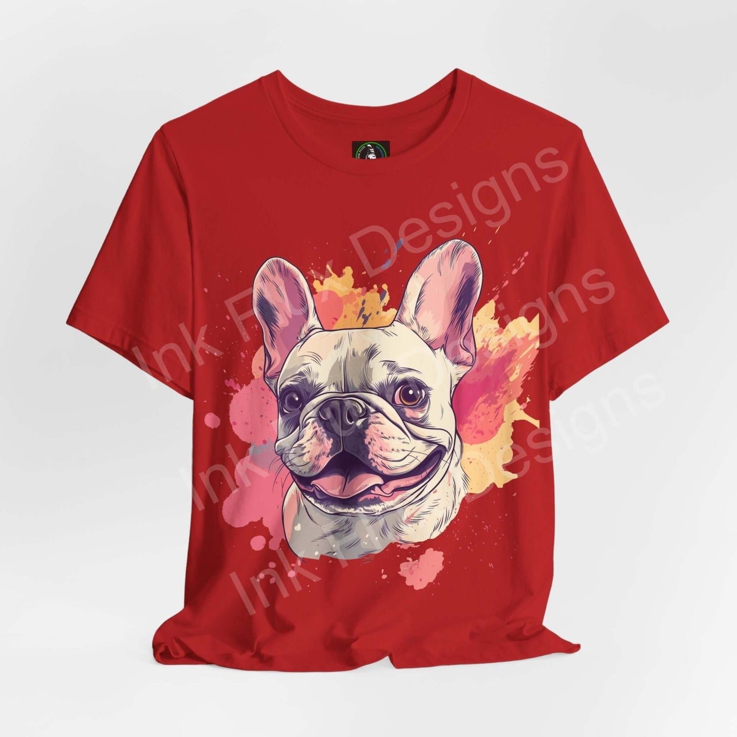 Red unisex T-shirt featuring a graphic print of a smiling French Bulldog surrounded by vibrant paint splashes, ideal for dog lovers and fashion enthusiasts.