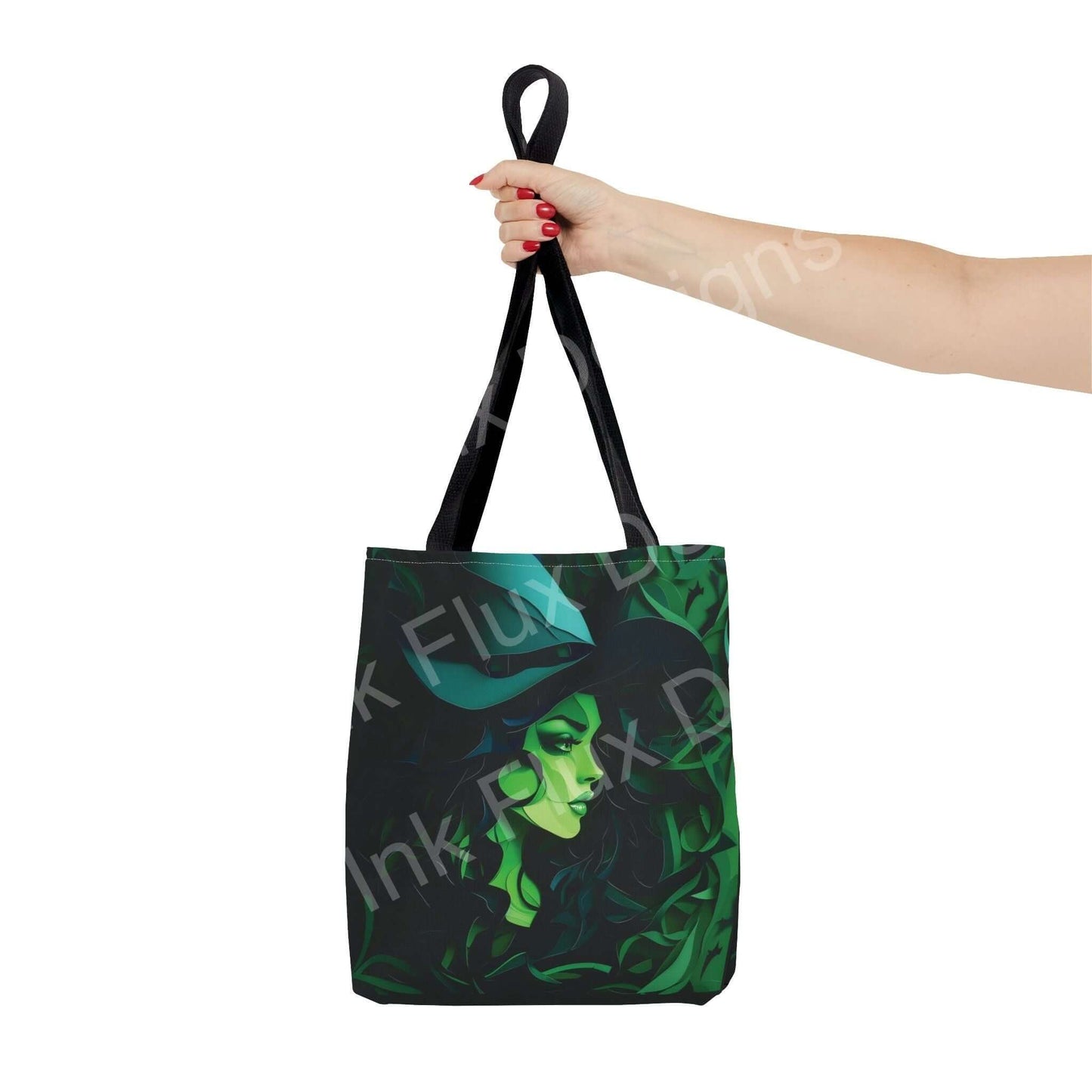 Woman's hand holding a Green Witch all-over print tote bag, showcasing vibrant green witch design and black straps.