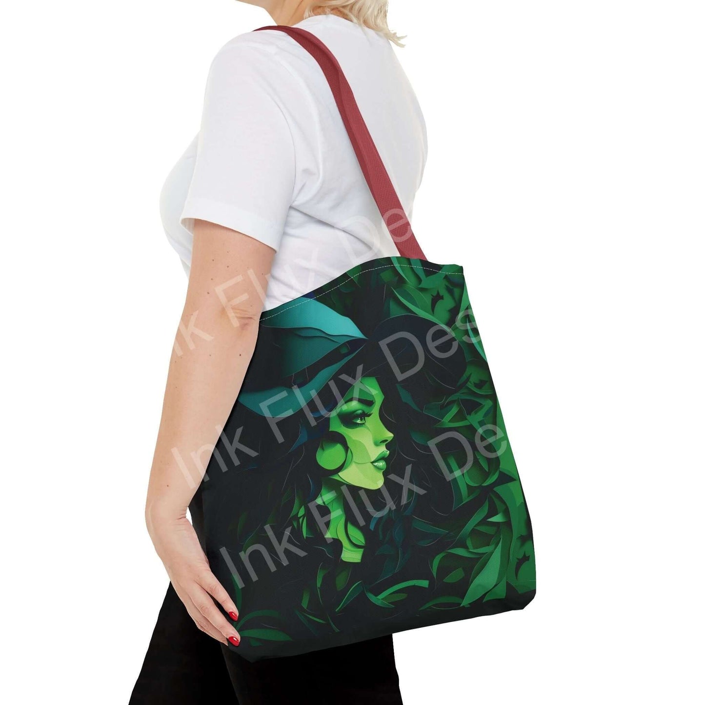 Woman carrying a green witch-themed all-over print tote bag with red strap, showing high-end durable design and style