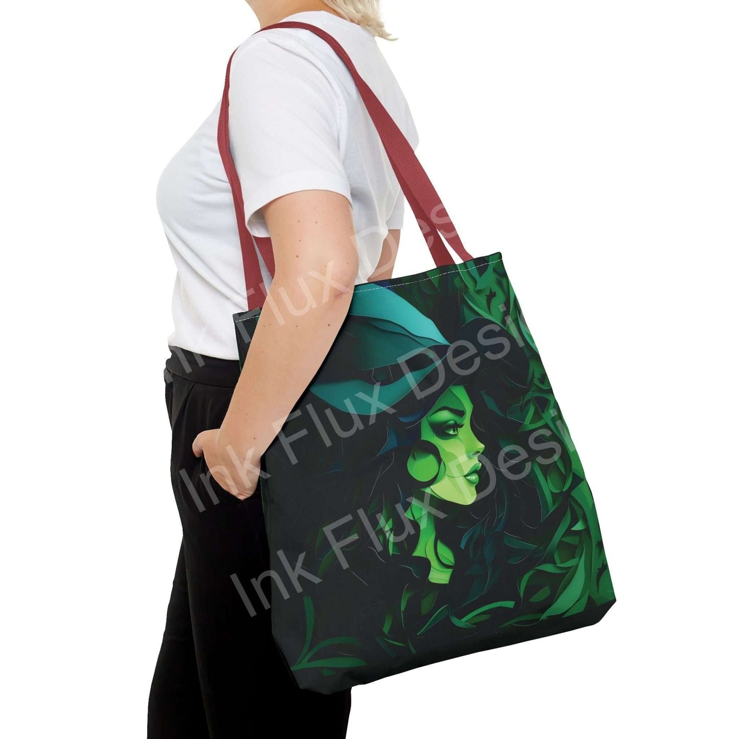 Woman carrying a green witch all-over print tote bag with red straps, showcasing its durable design and vibrant graphic print.