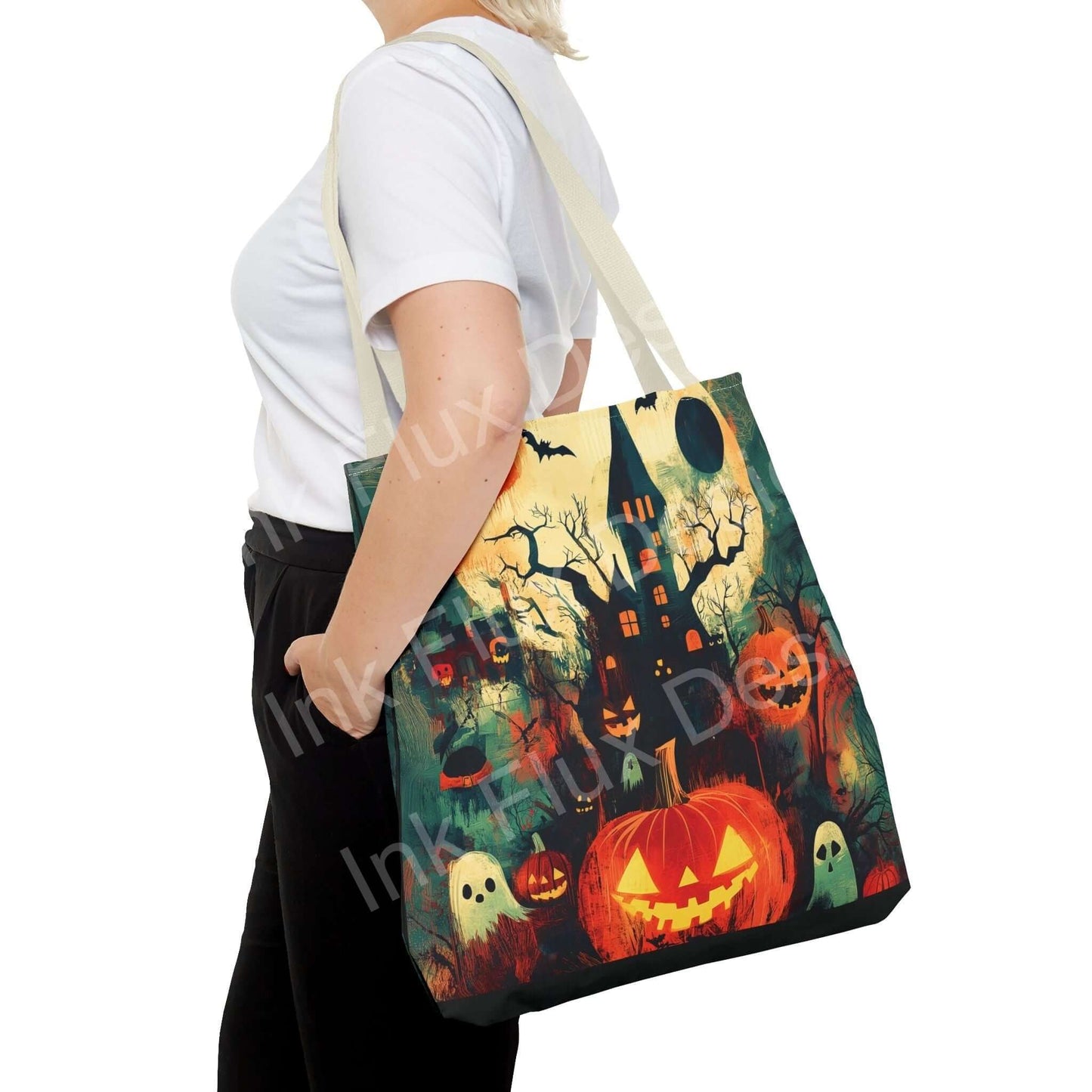 Woman carrying a Halloween-themed tote bag featuring pumpkins, haunted house, and ghosts, ideal for seasonal style and functionality.