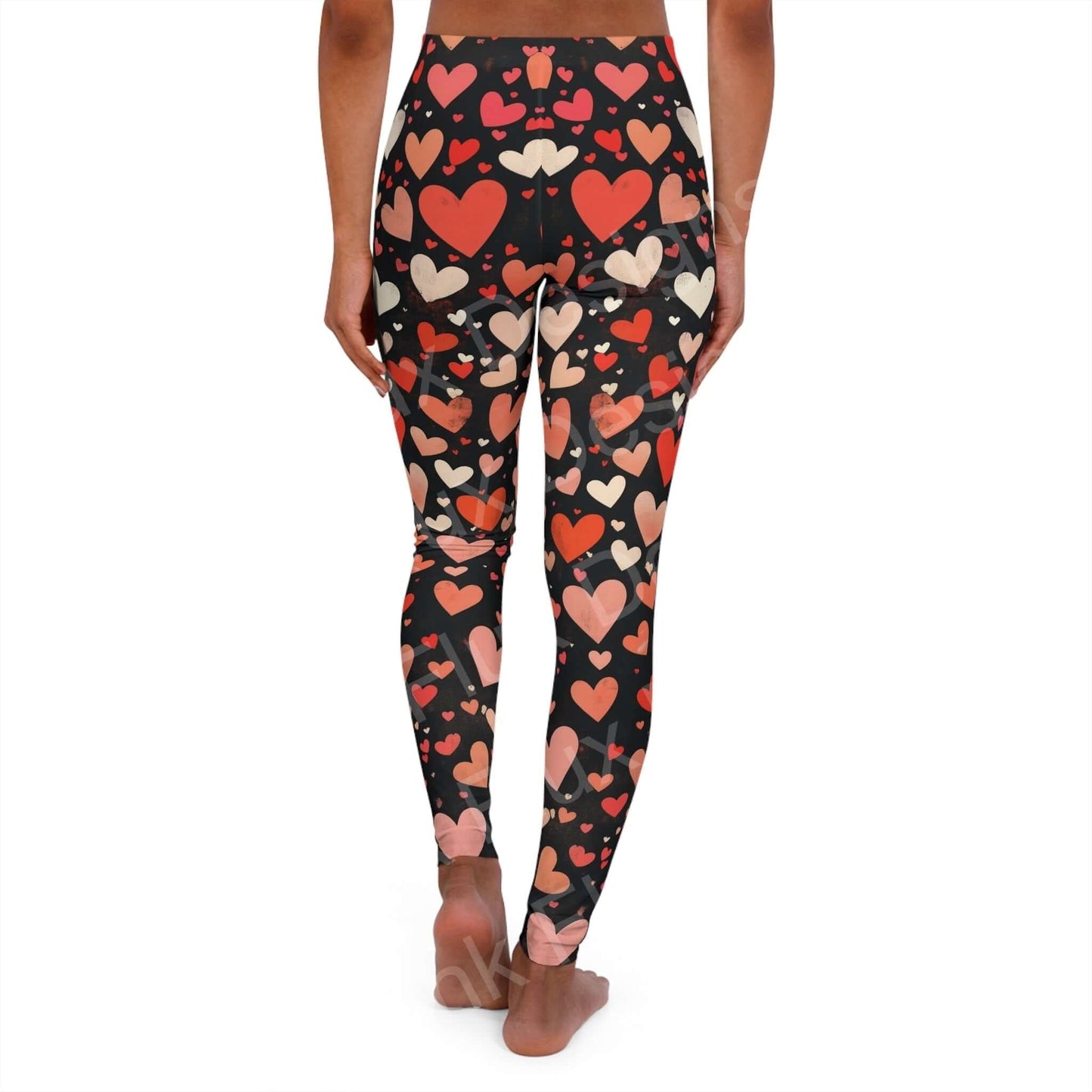 Woman wearing Hearts Collage Leggings with bold designs, showcasing the stretchy and durable fabric, perfect for workouts and casual wear.