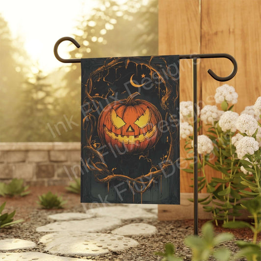 Halloween Garden Flag featuring a spooky Jack O Lantern surrounded by autumn textures and branches.