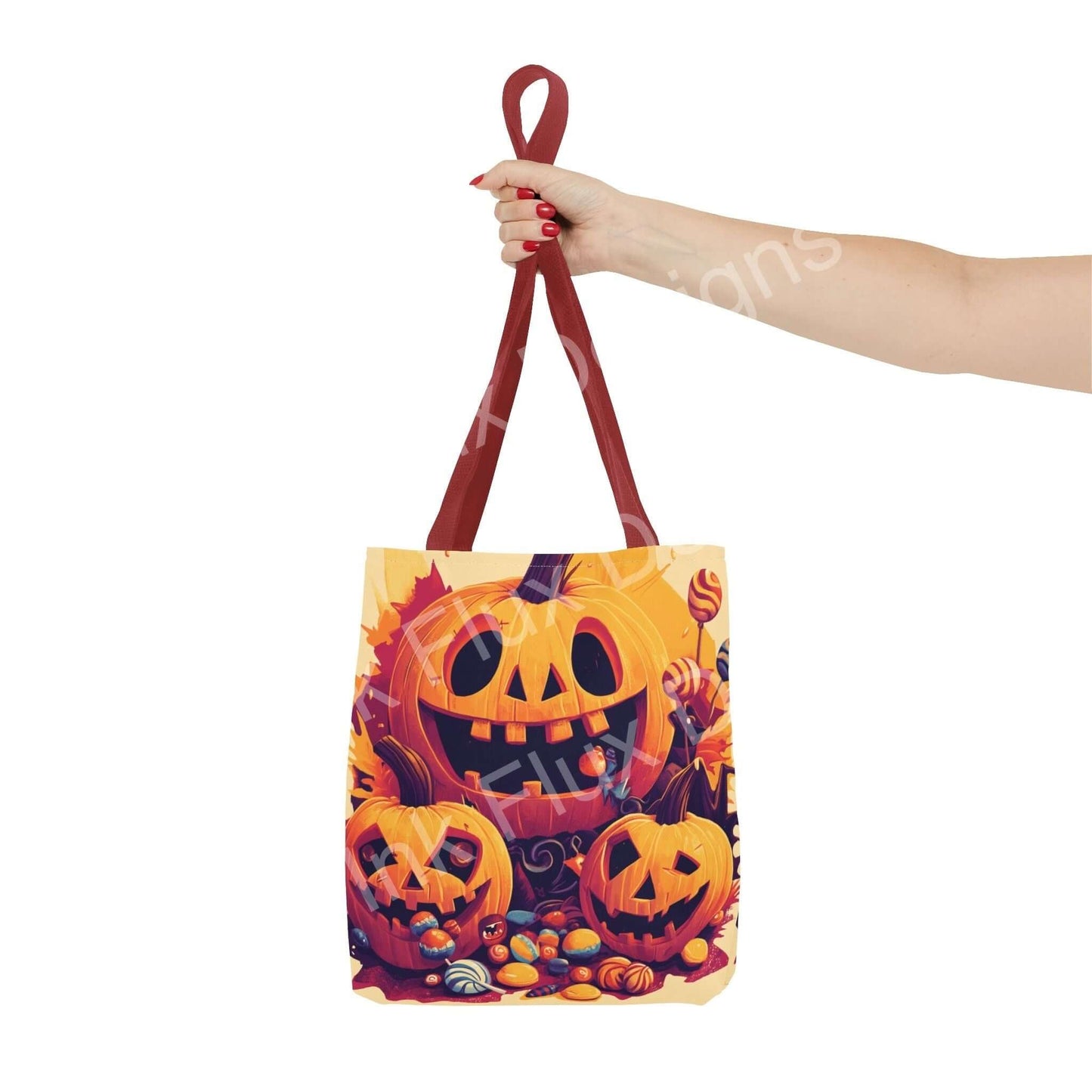 Person holding a vibrant Jack o Lantern tote bag with colorful Halloween-themed print and red handles, made of durable polyester.