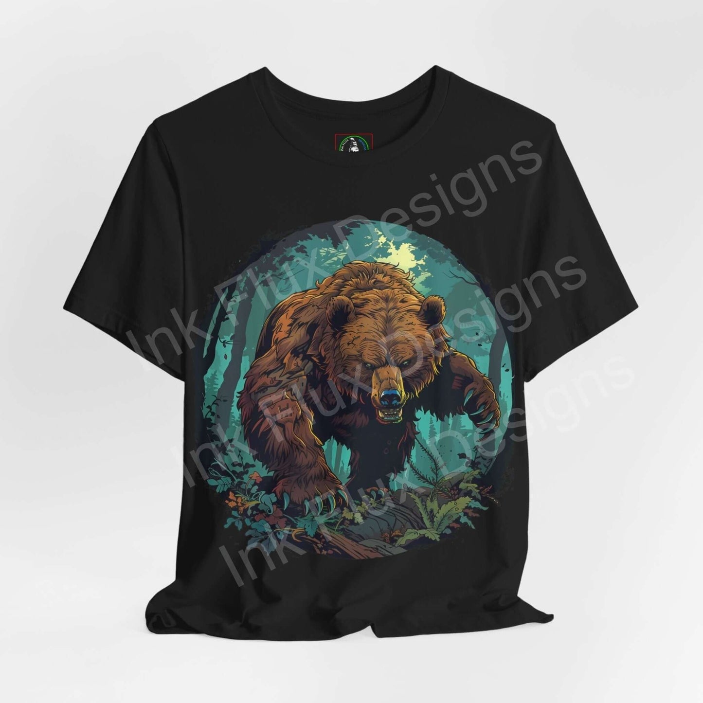 Unisex black T-shirt featuring a graphic design of a Kodiak bear amid lush foliage, from the spirit animals collection by Bella+Canvas.